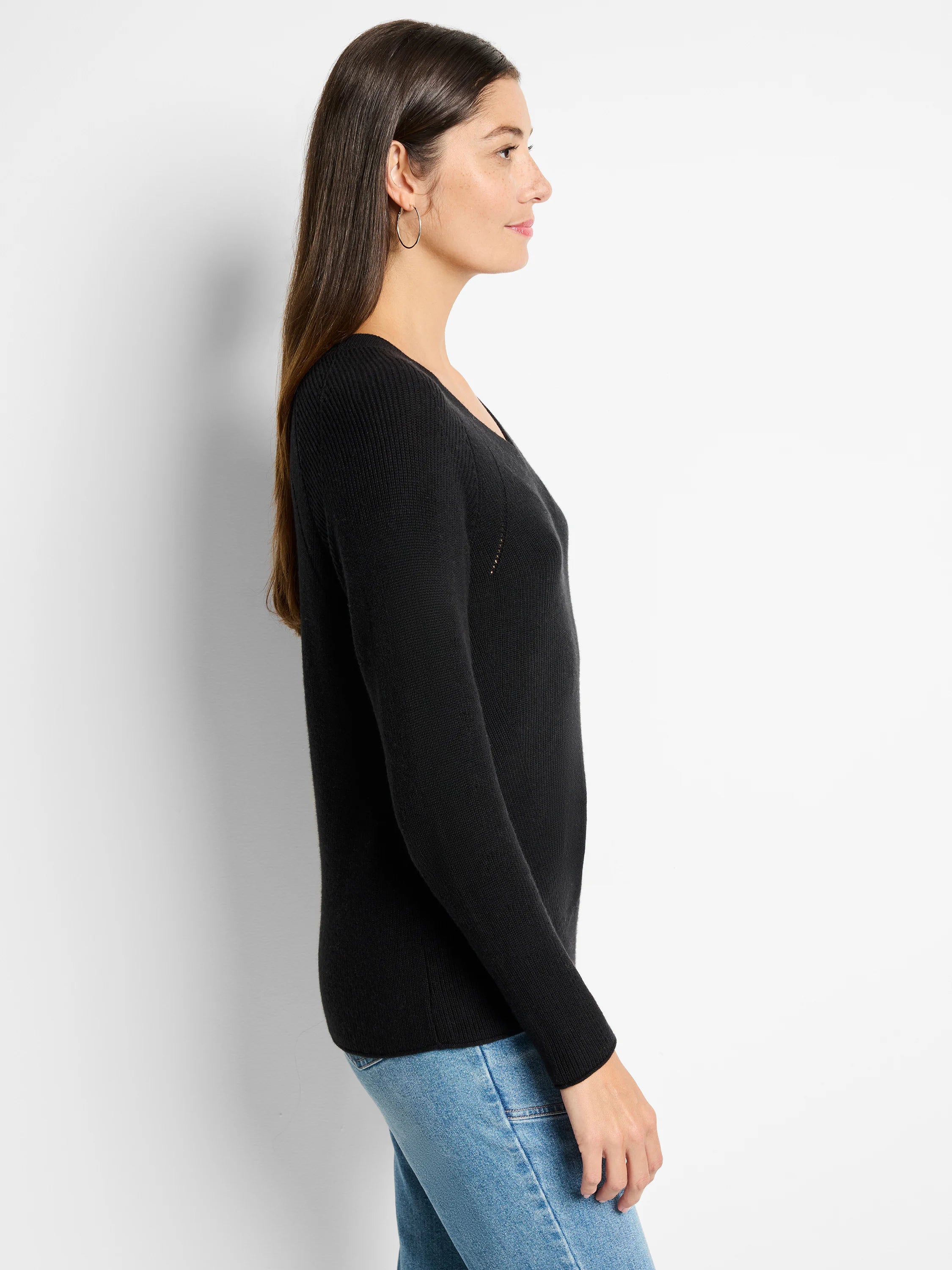 Black, long-sleeved V-neck sweater; ribbed knit texture.
