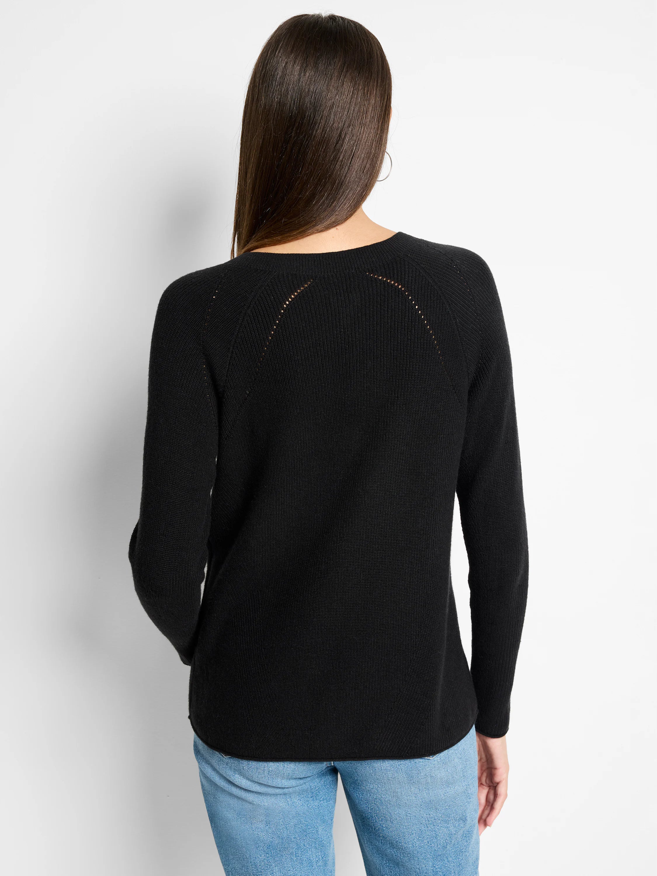 Black V-neck cashmere sweater; ribbed knit; eyelet detail at shoulders.