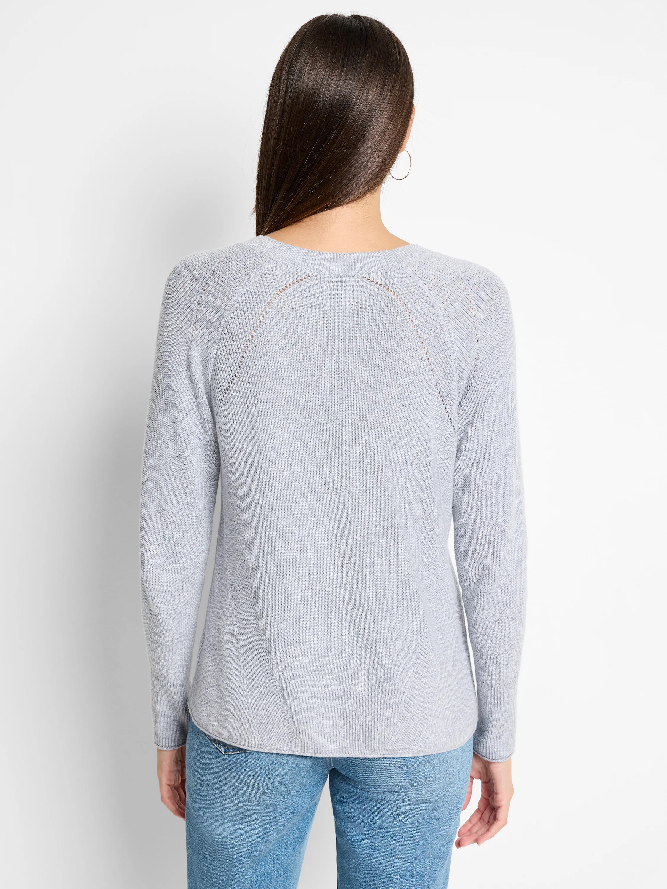 Light gray, V-neck, long-sleeved cashmere blend sweater. Ribbed texture, subtle openwork detail at shoulders.
