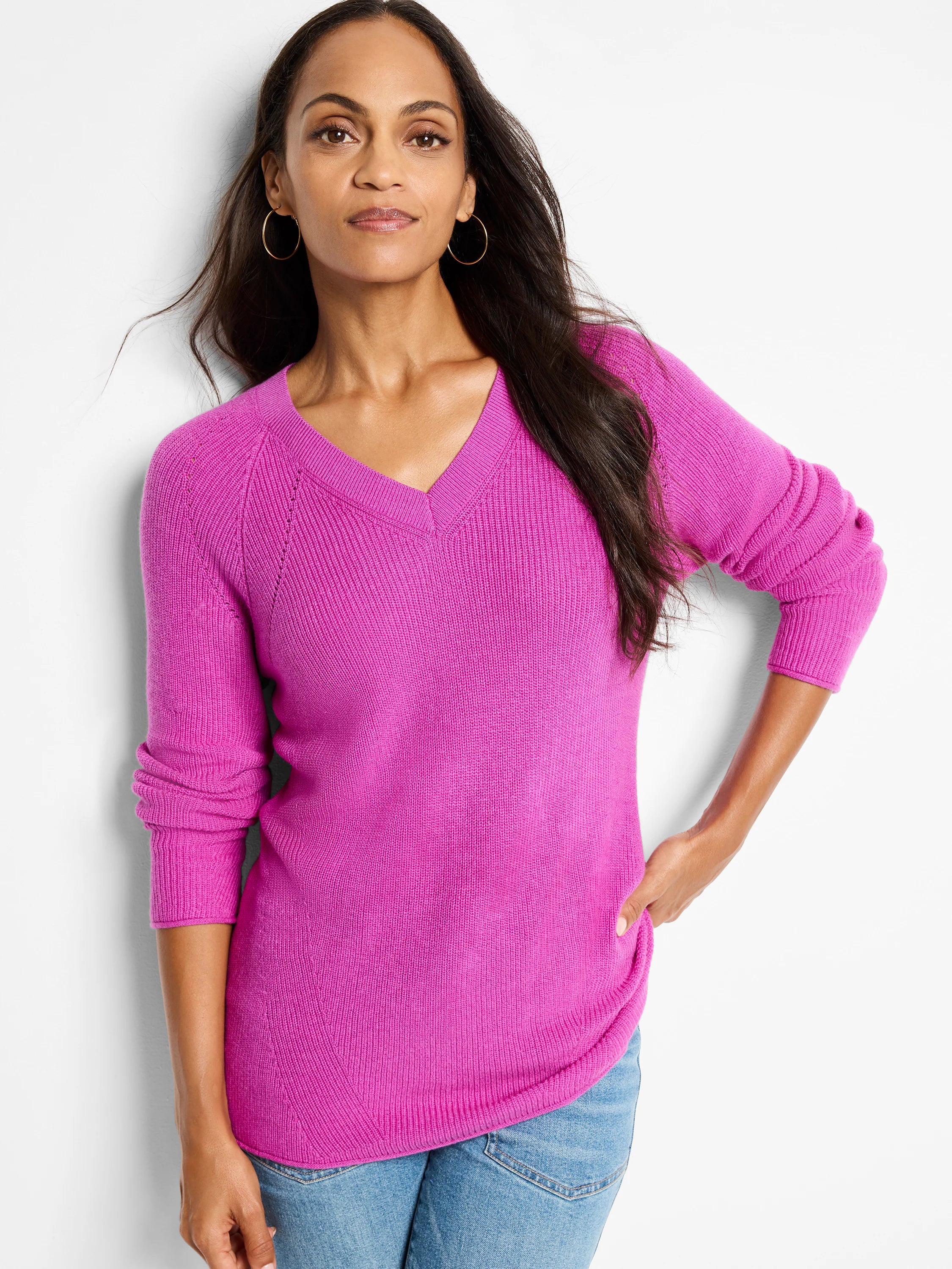Fuchsia pink, V-neck, long sleeves, ribbed knit.