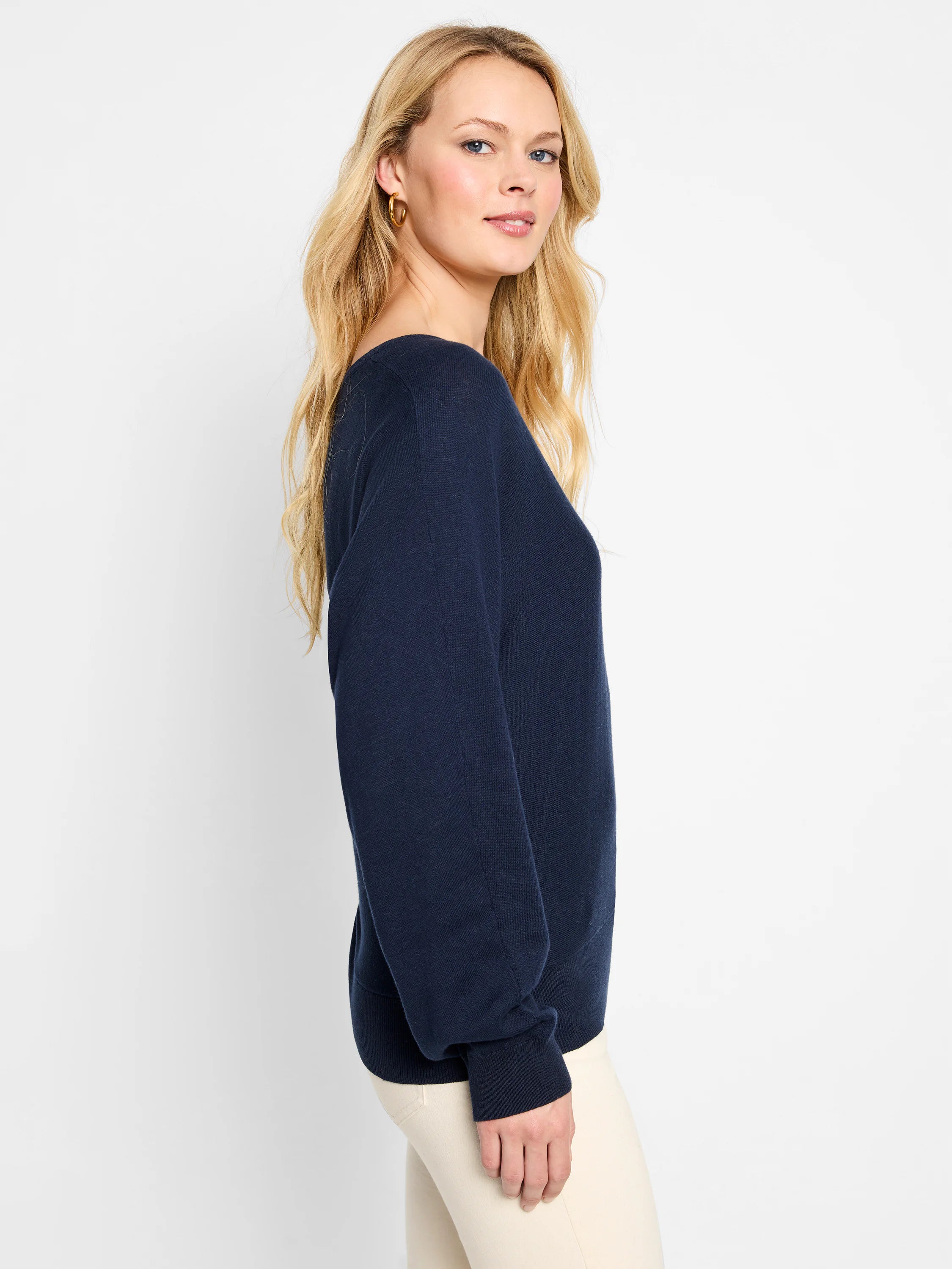 Navy blue dolman-sleeve sweater. Loose fit, boat neckline.