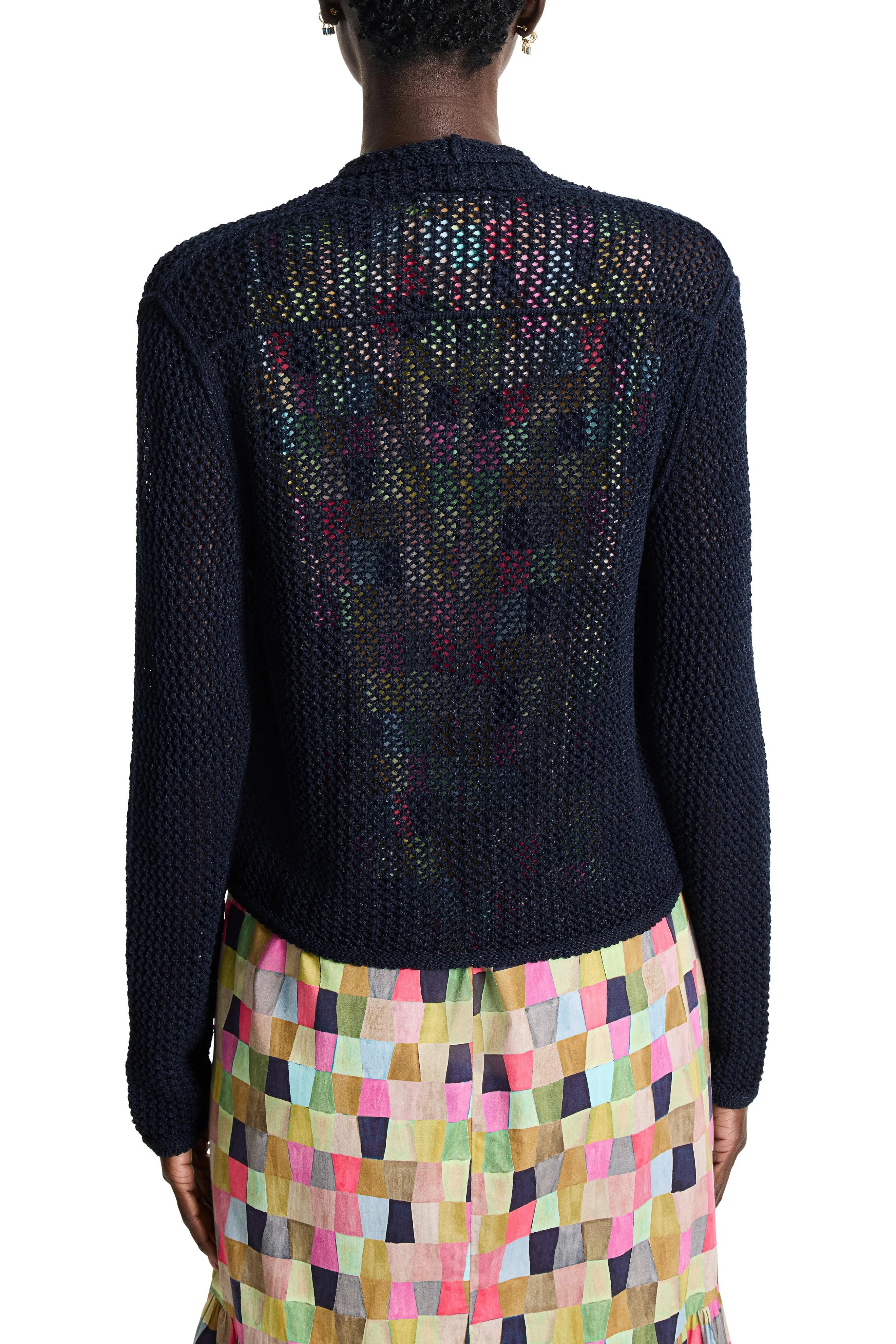 Dark navy blue mesh cardigan, open back revealing multicolored pattern. Long sleeves.