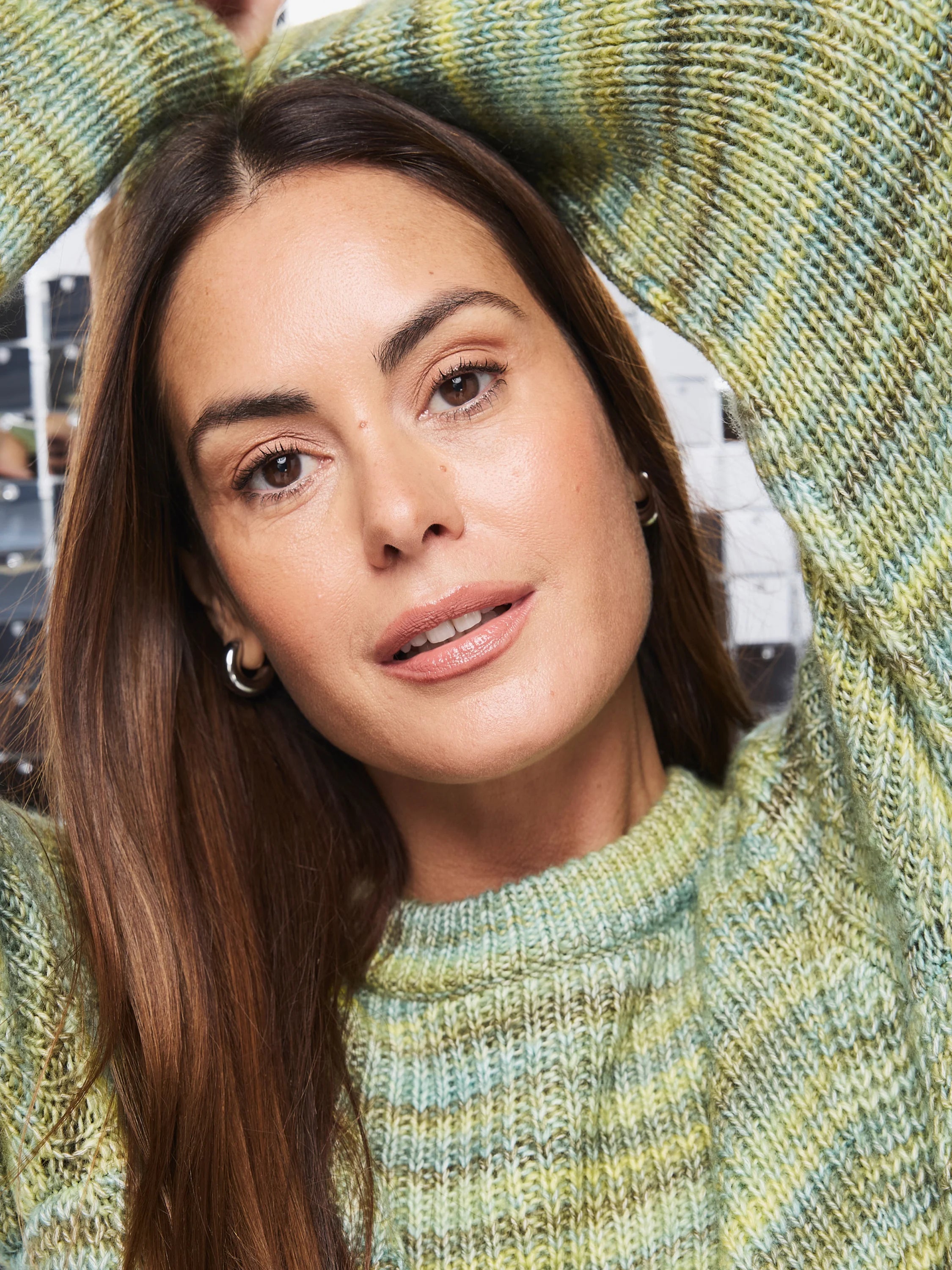 Variegated knit sweater: light green, pale yellow, muted blue. Ribbed crew neck.