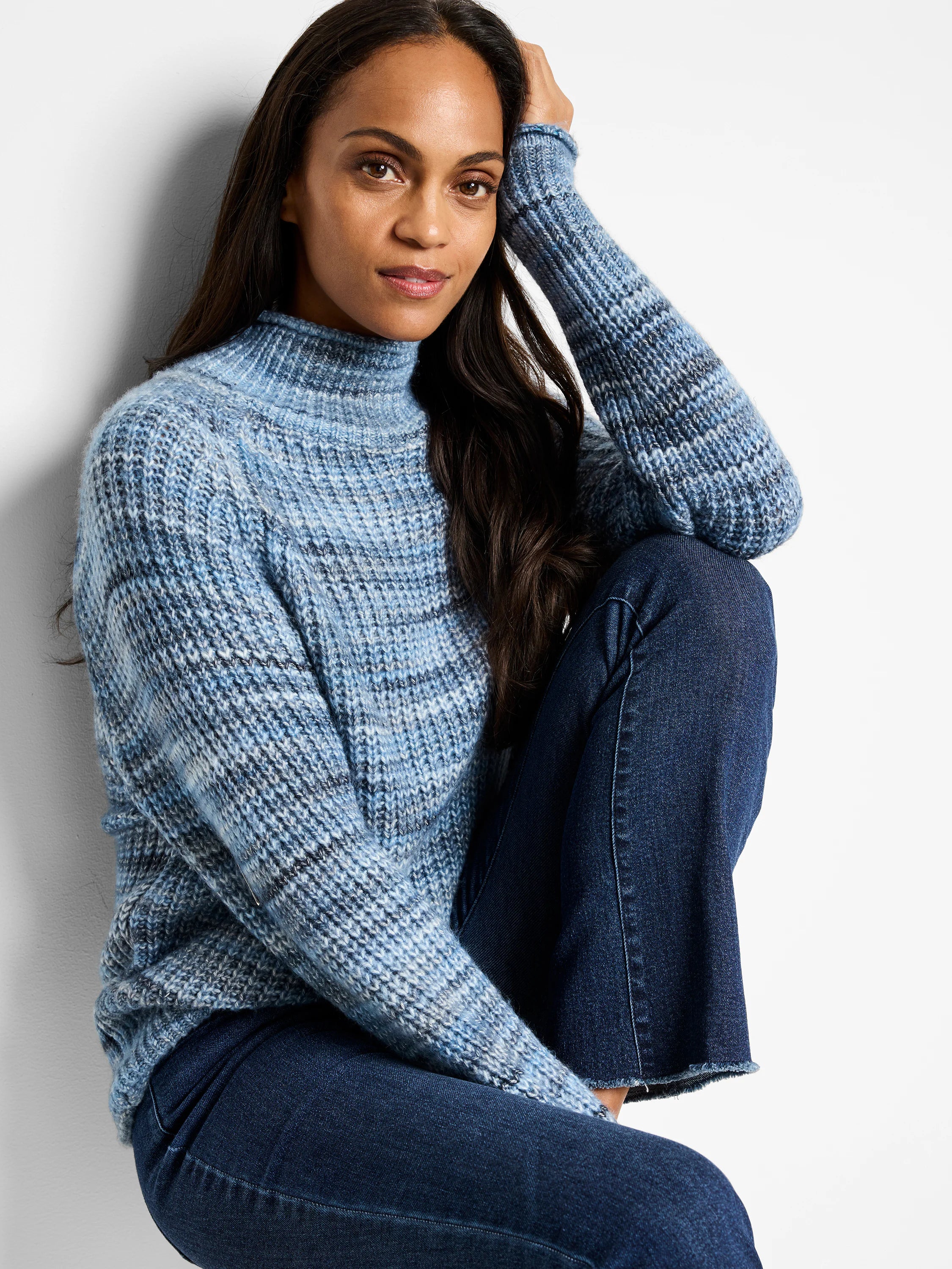 Blue and white striped, knit, mock neck sweater. Long sleeves.