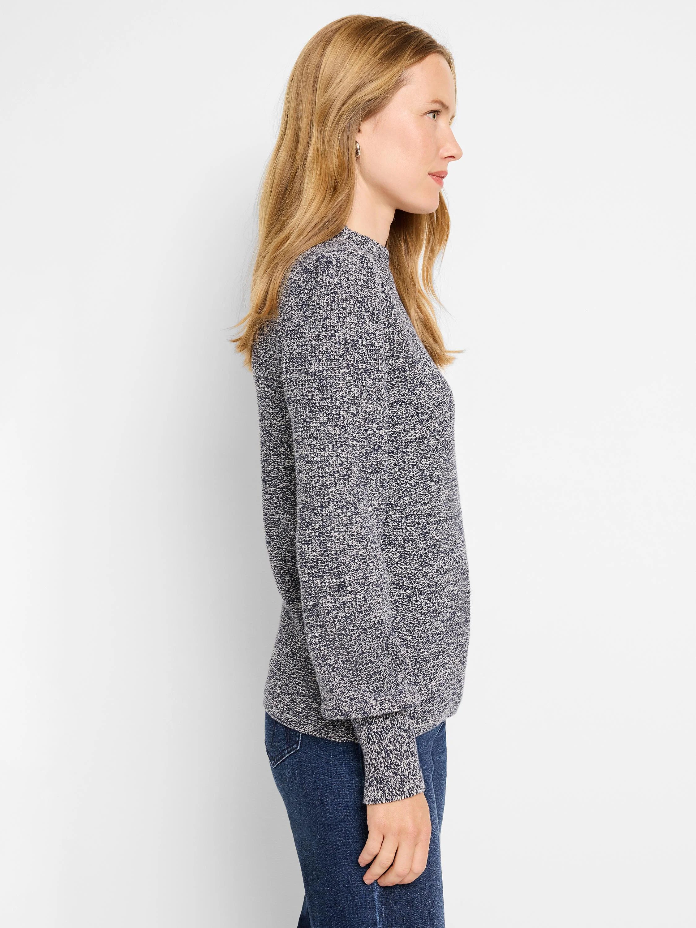 Model wears a marled blue & white waffle stitch sweater with a crew neck, long sleeves, relaxed fit.
