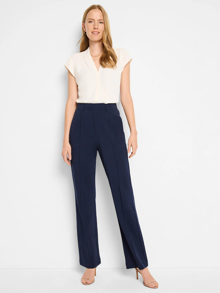 Navy blue wide-leg pants with center creases; pleated detail.