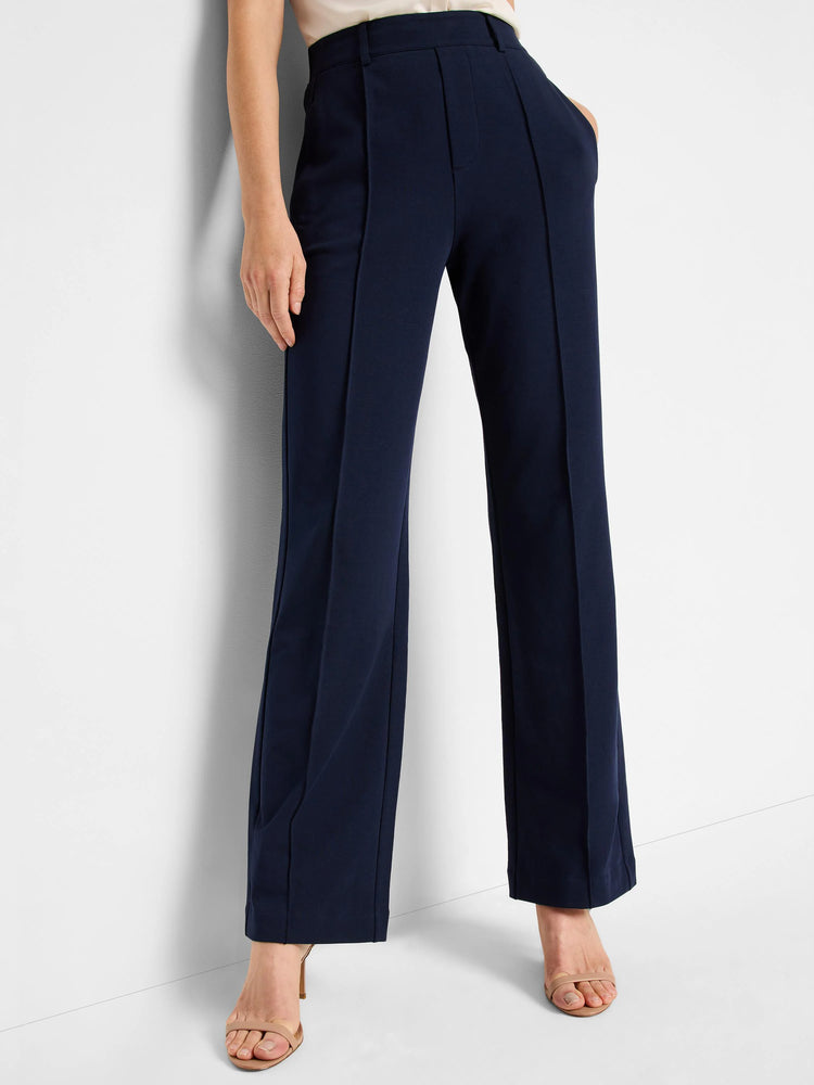 Navy blue, wide-leg pleated pants. High-waisted with center pleats.