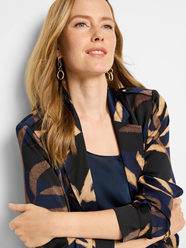 Midnight Fern trench jacket in navy, black, and beige abstract print. Long sleeves, button cuffs.
