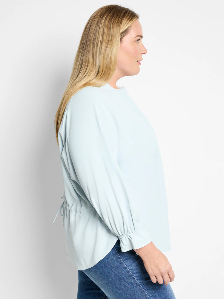 Light blue, 3/4 sleeve blouse with a slightly rounded hem and drawstring back.