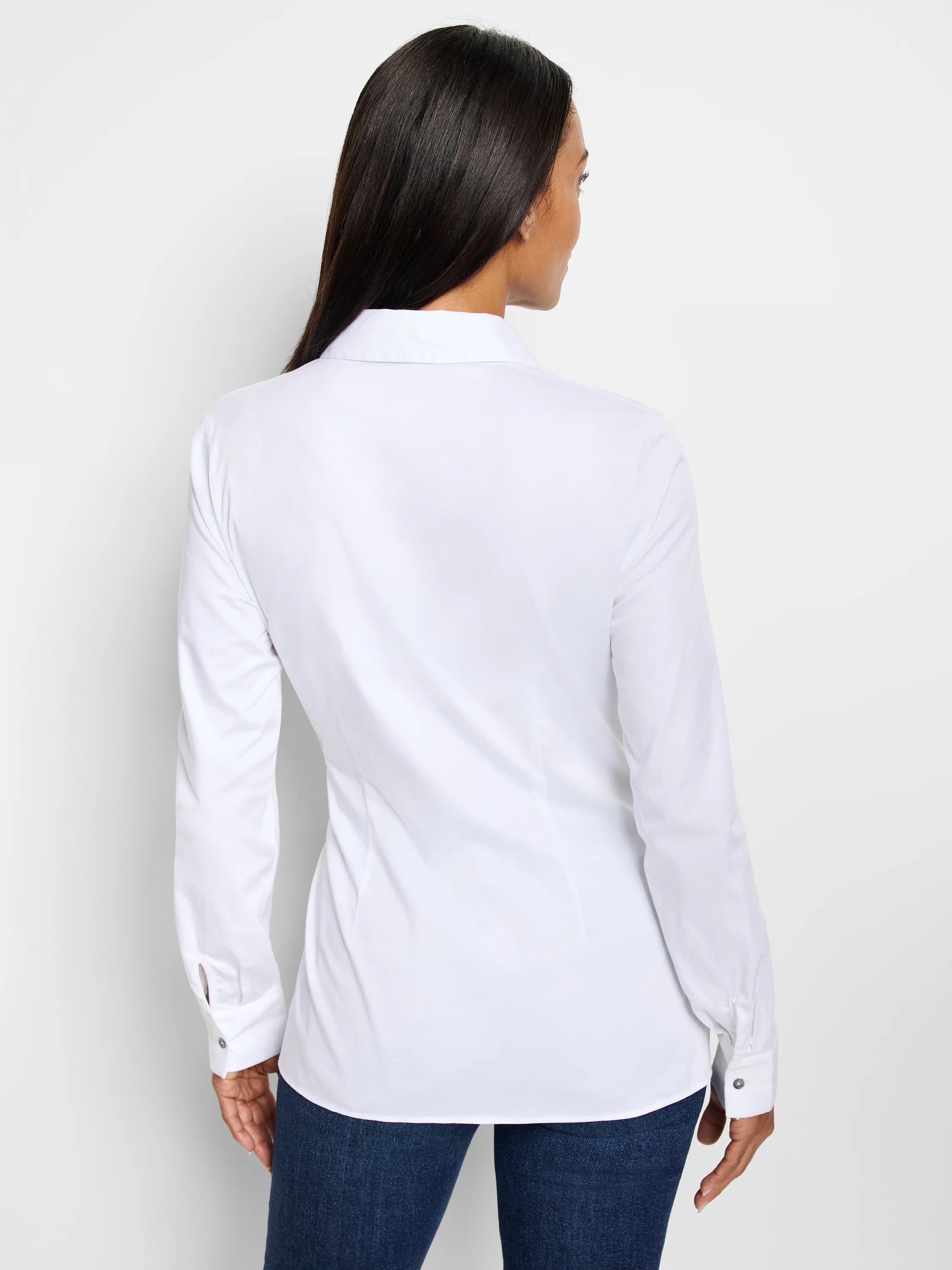 White long-sleeve collared shirt, shown from the back. The shirt has button cuffs.