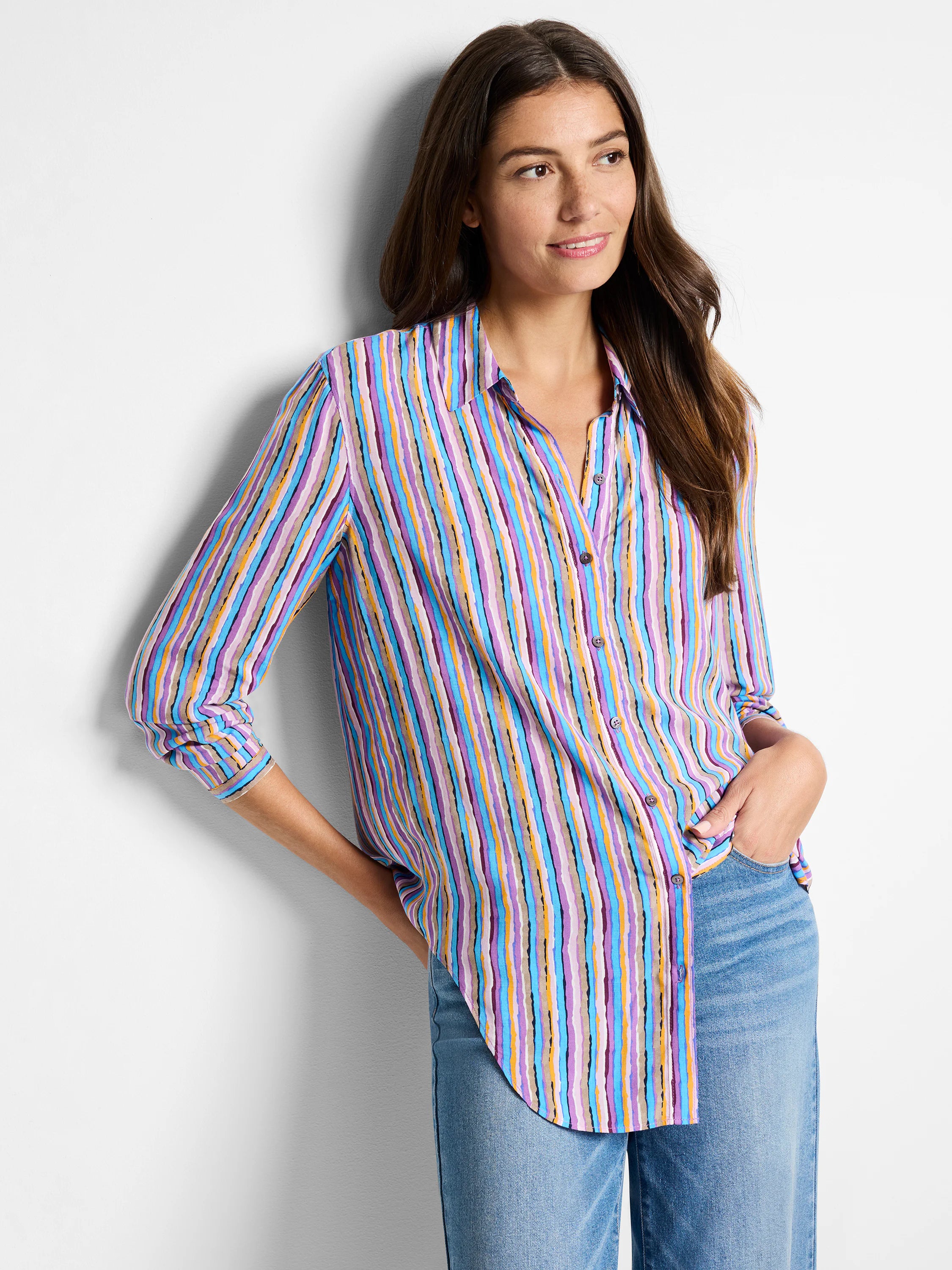 Multicolored vertical stripes on a long-sleeve button-down shirt. Colors include purple, blue, light pink, tan, and dark...