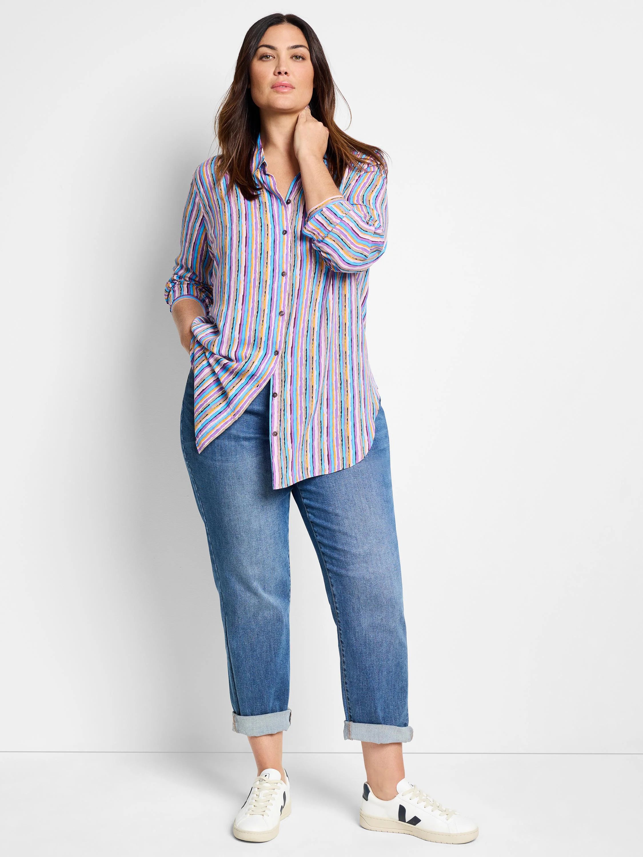 Multicolored vertical stripes on a long-sleeve button-down shirt. Colors include purple, blue, pink, and beige.