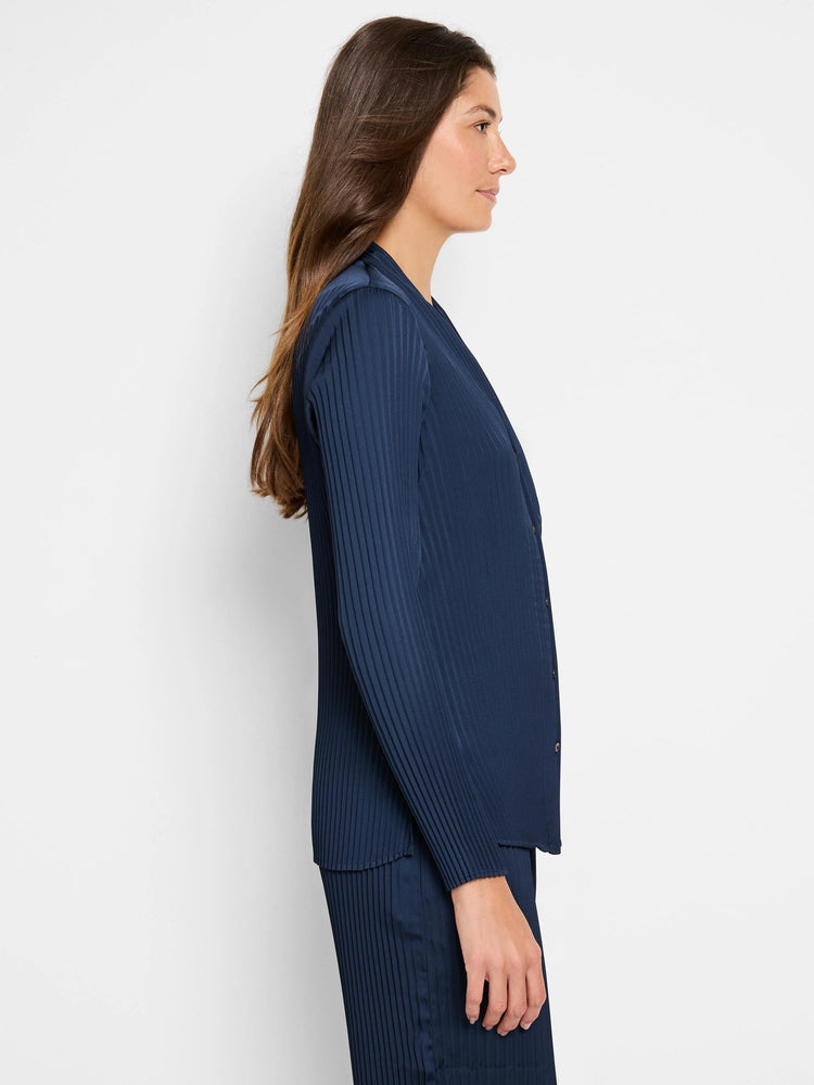 Navy blue, long-sleeved pleated shirt. Vertical pleats, button front.