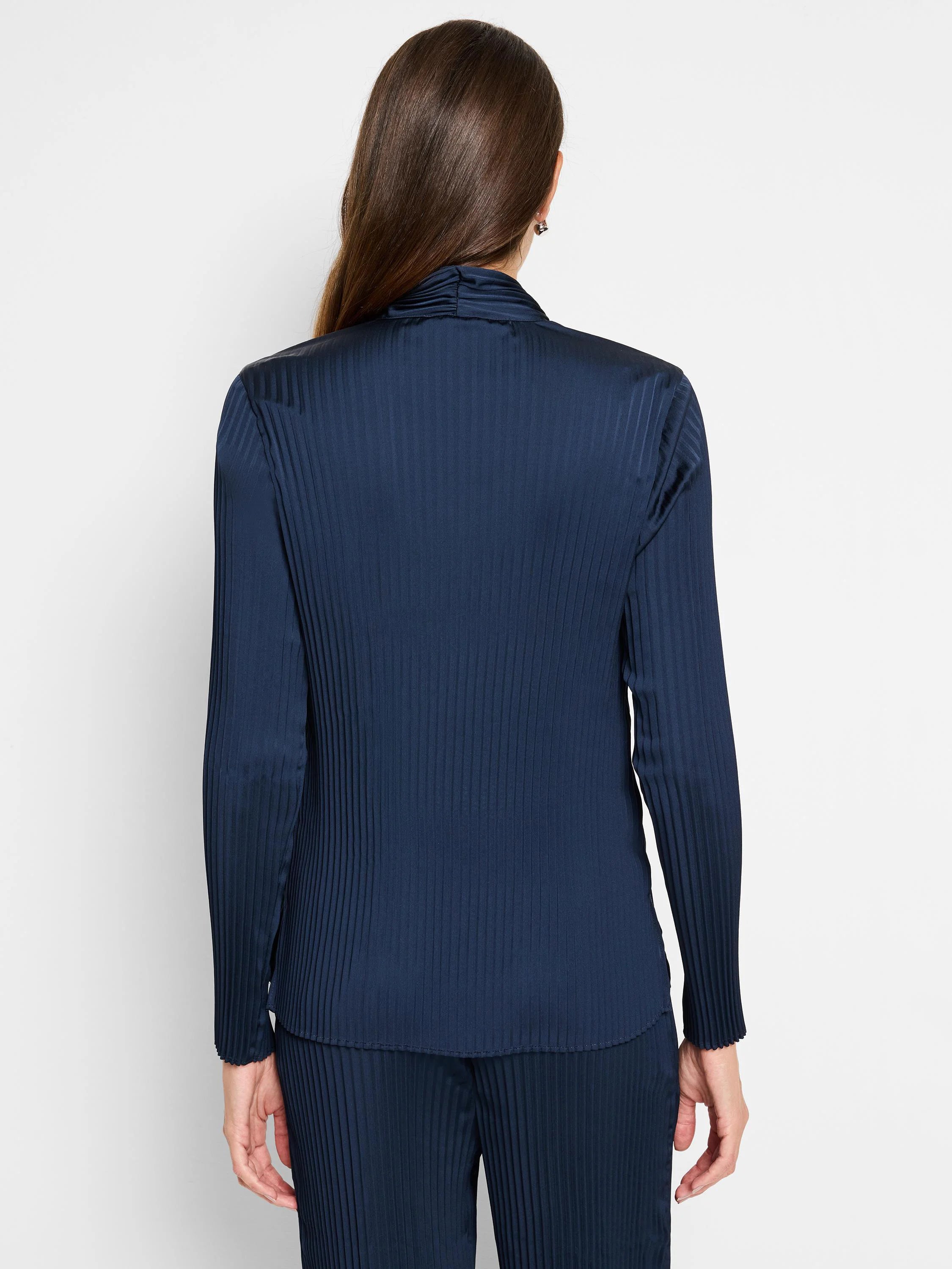 Dark navy blue, vertically pleated long-sleeve shirt; back view.