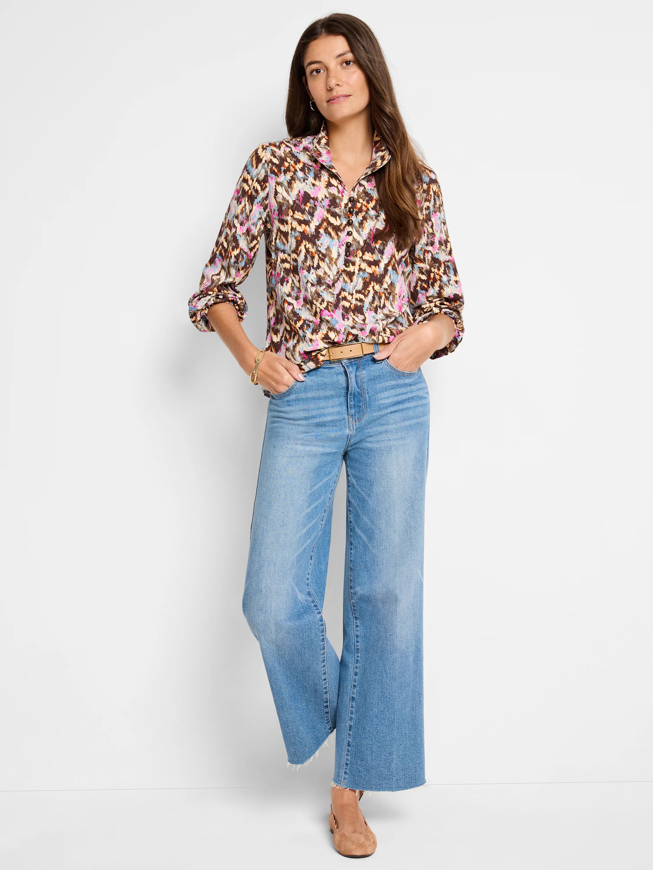 Brown, beige, pink, and blue abstract print blouse; long sleeves, collared.