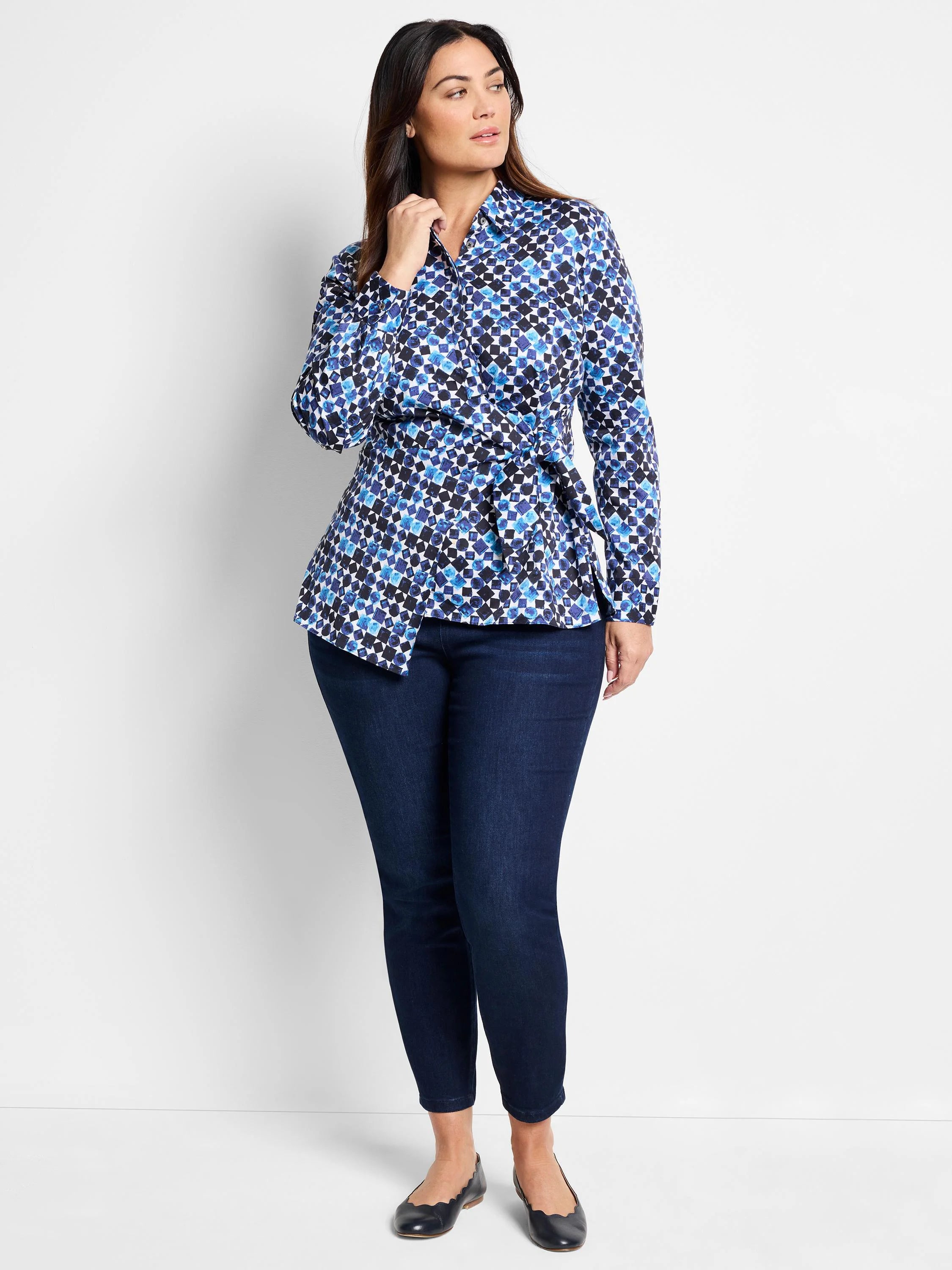 Blue, black, and white patterned shirt; side tie; long sleeves; asymmetrical hem.