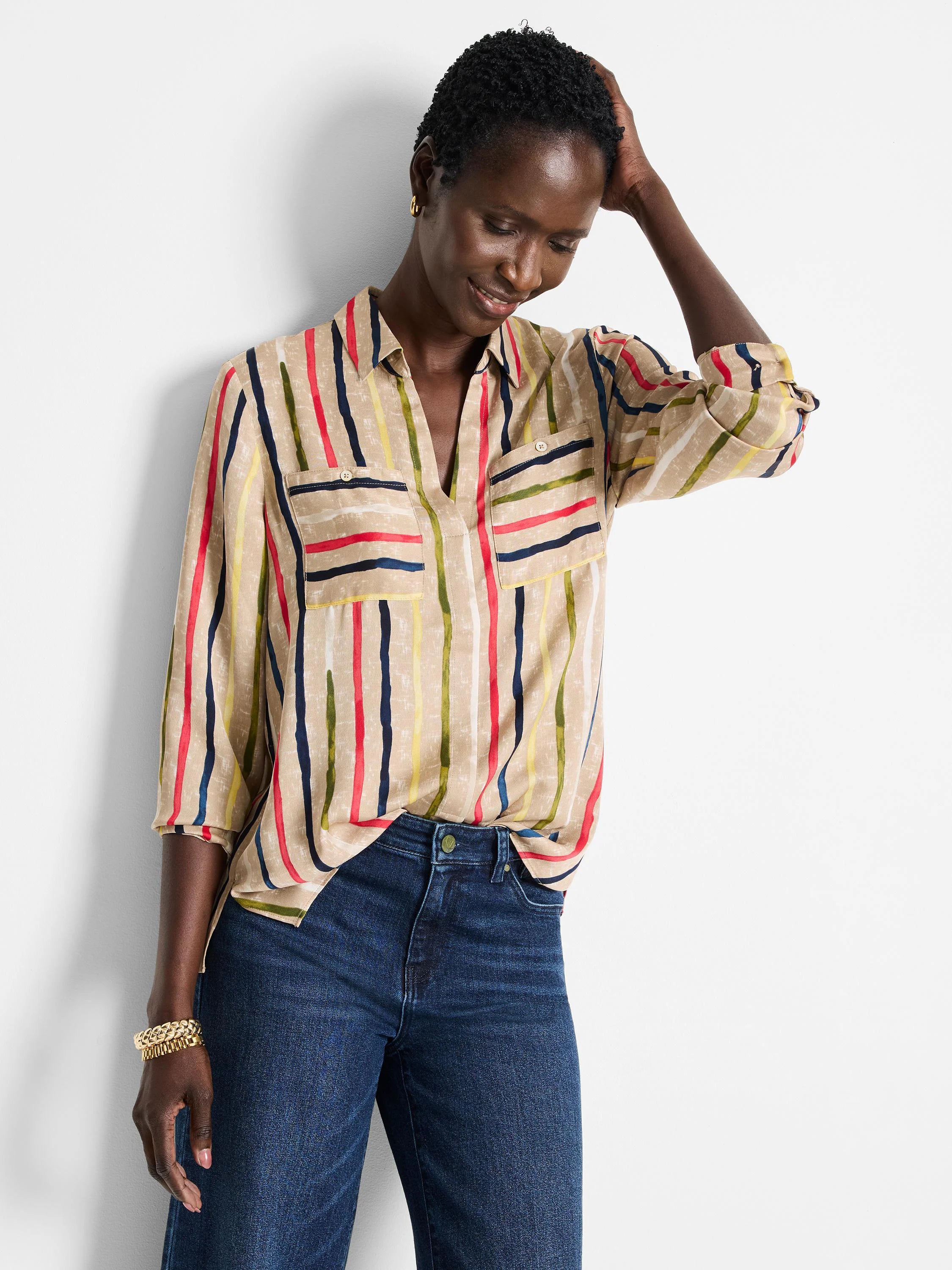 Beige top with painted red, navy, yellow, green vertical stripes, collar, and chest pockets.
