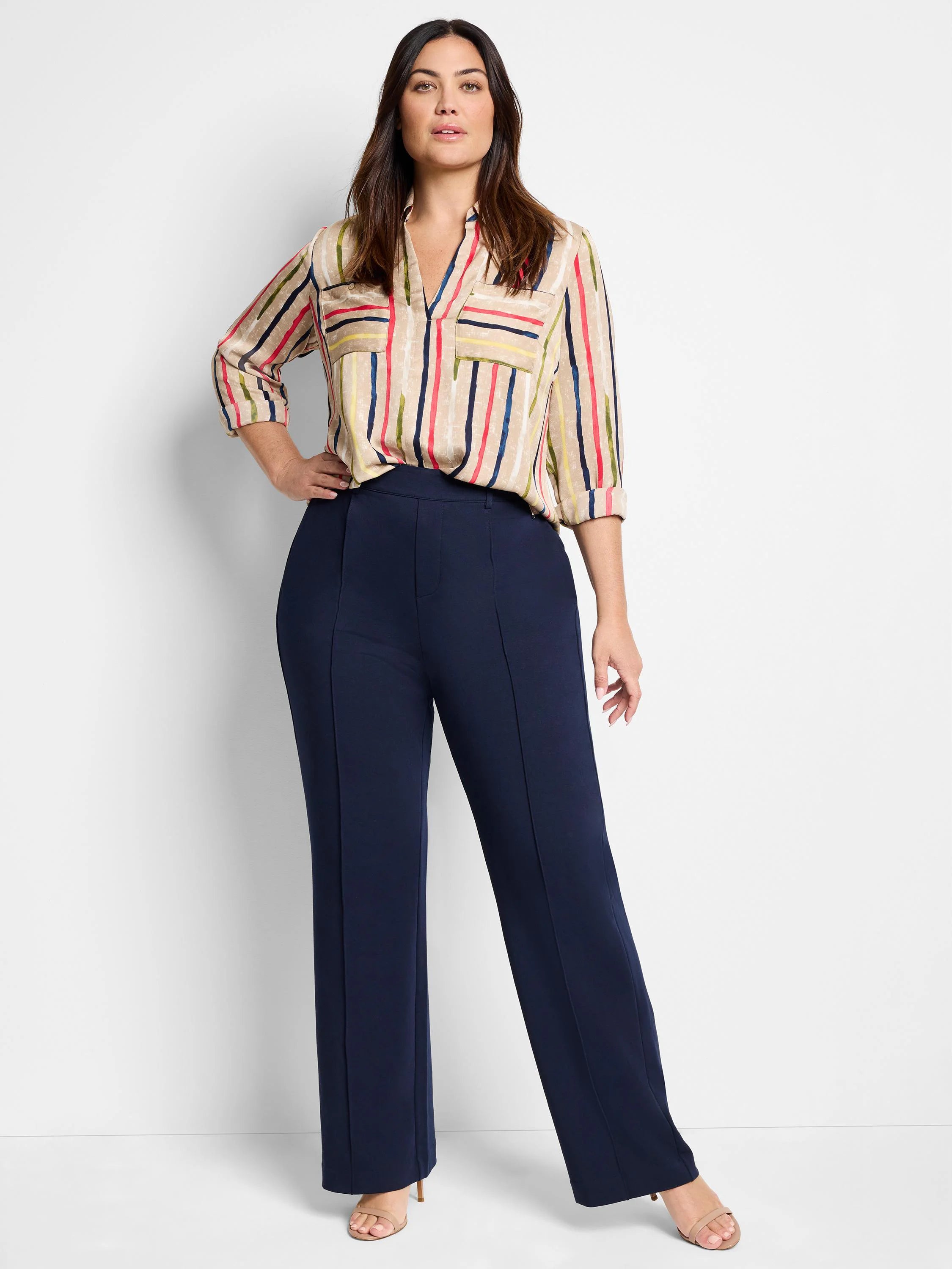 Beige blouse with painted vertical stripes in red, blue, green, and yellow. V-neck, chest pockets, 3/4 rolled sleeves.