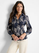 Dark navy blue long-sleeve shirt with a collared neckline. Features a cream and white zebra stripe pattern. Button front.