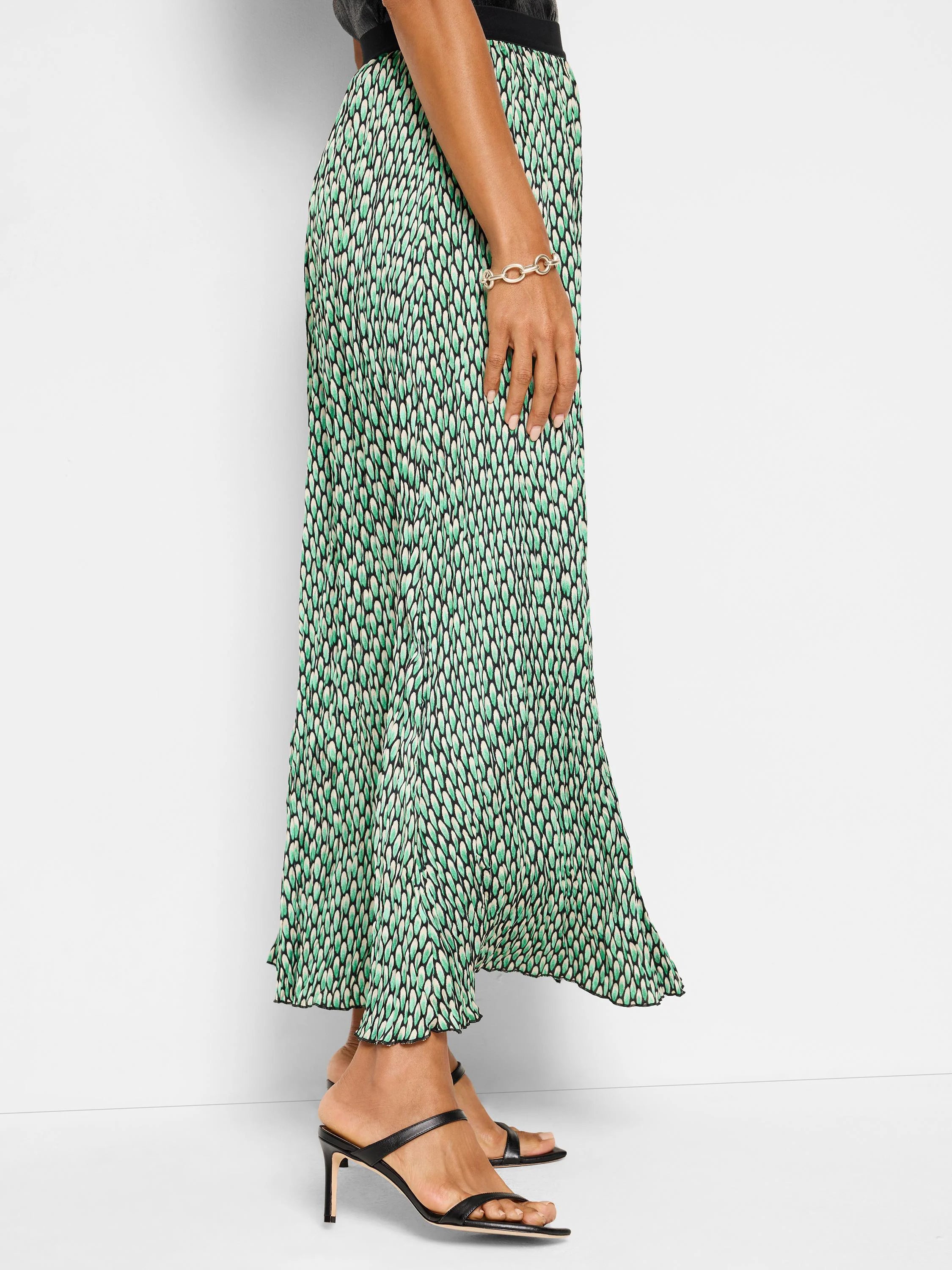 Pleated midi skirt; green, black, & cream abstract dot print.