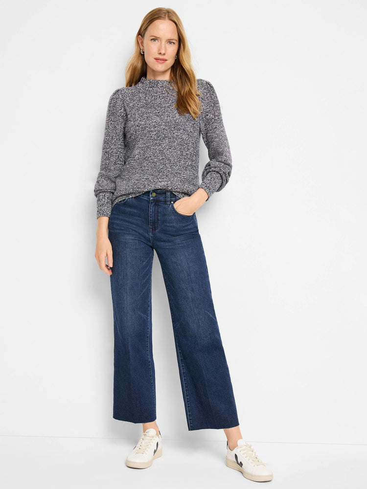 Dark blue, wide-leg, cropped jeans with a raw hem.