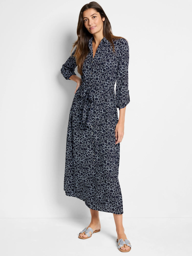 Navy midi dress with light blue dot pattern, collared, 3/4 sleeves, belted waist.