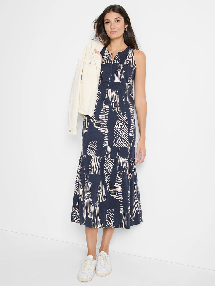 Sleeveless midi dress in navy blue with beige zebra stripes. Tiered skirt.