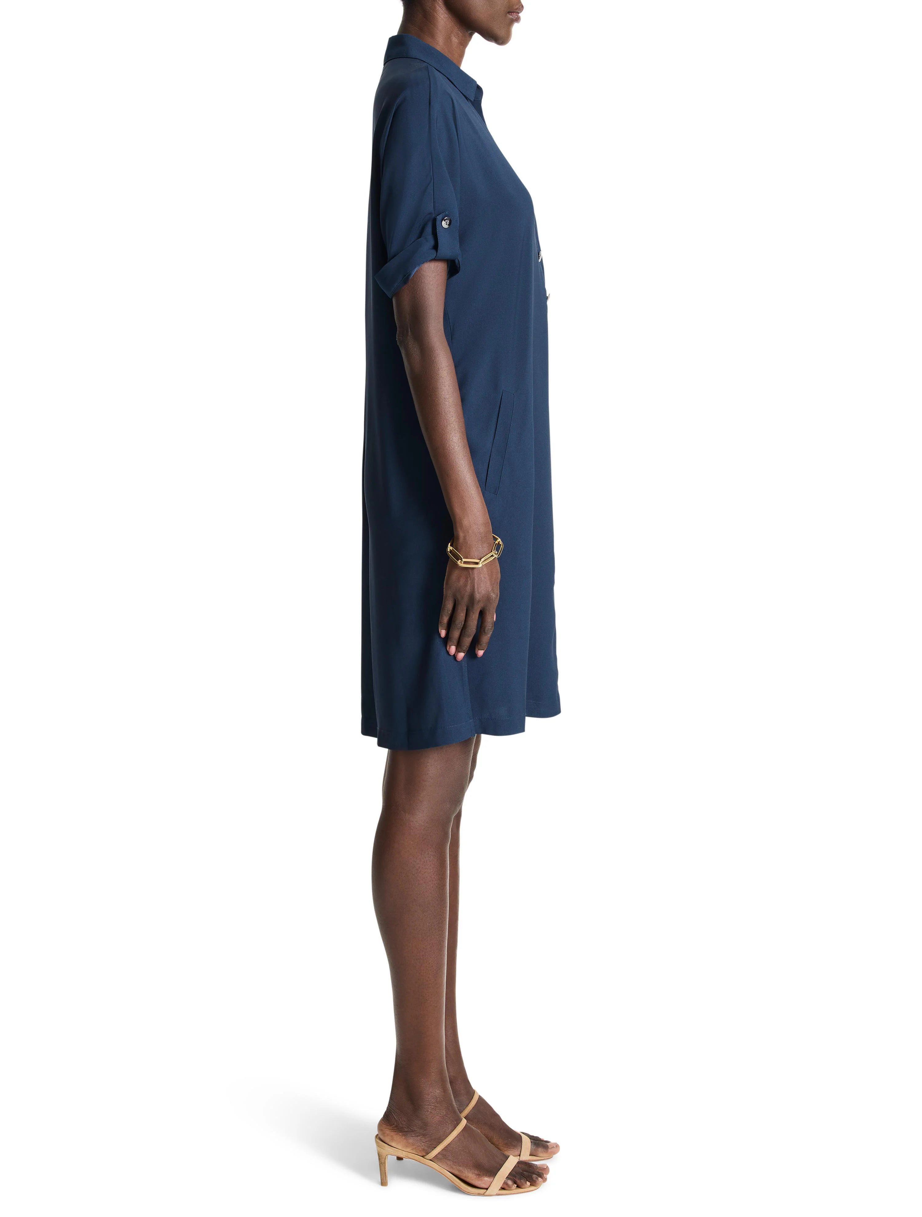 Dark blue collared shirt dress with short, cuffed sleeves, front buttons, and side pockets. Above-knee length.