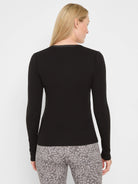 Black ribbed knit long-sleeve V-neck top, back view, with a trimmed neckline.