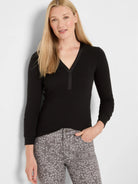 Black ribbed V-neck long-sleeve top with a black trim around the neckline.