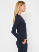 Dark navy blue ribbed knit V-neck long-sleeve top.