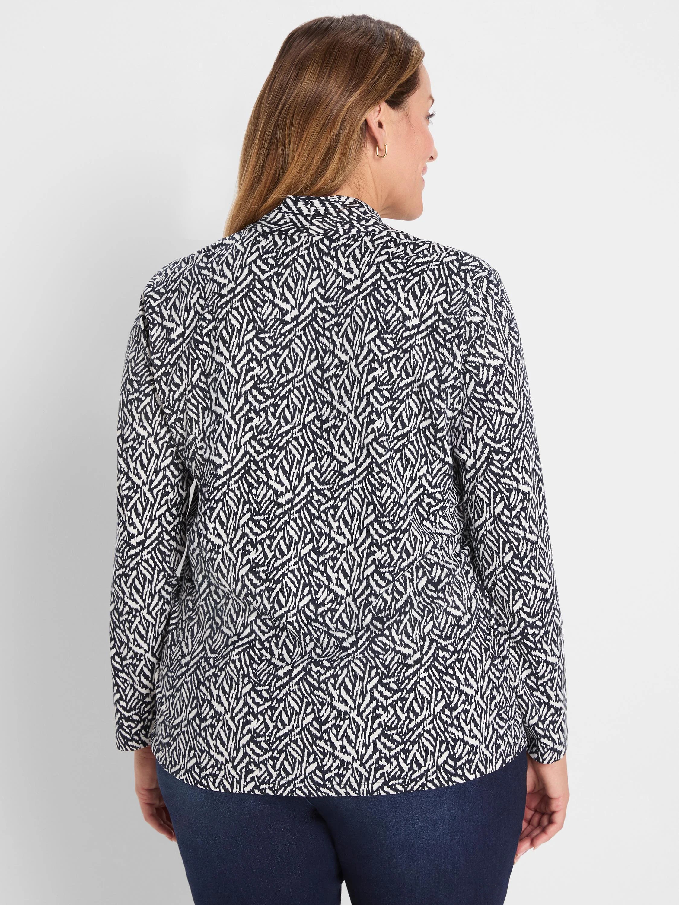 Navy and white Geo Toss patterned knit top, long sleeves. Back view.
