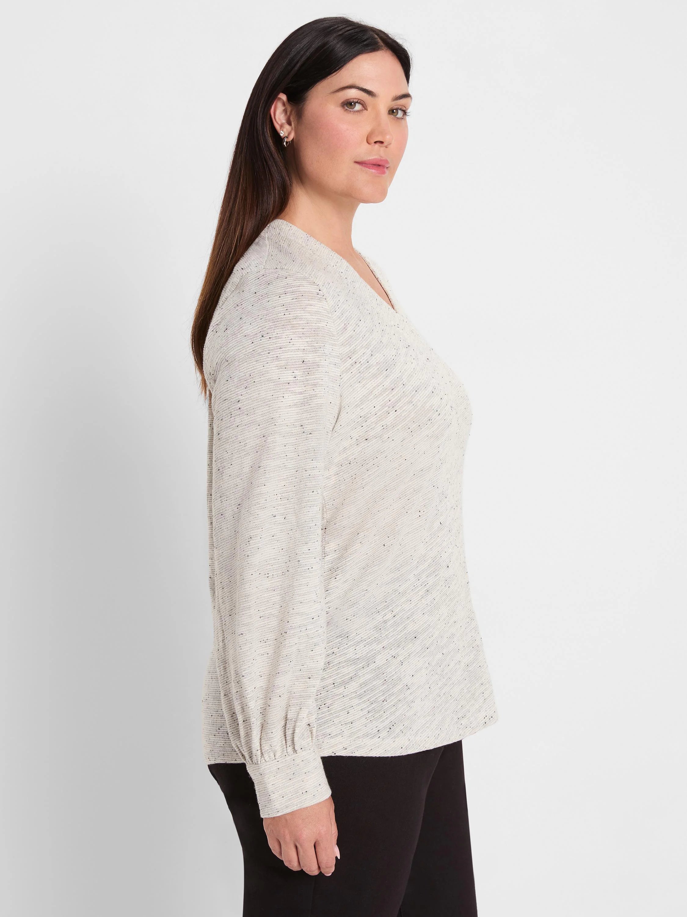 Light grey V-neck knit top with dark flecks & subtle shimmer. Long sleeves have gathered cuffs.