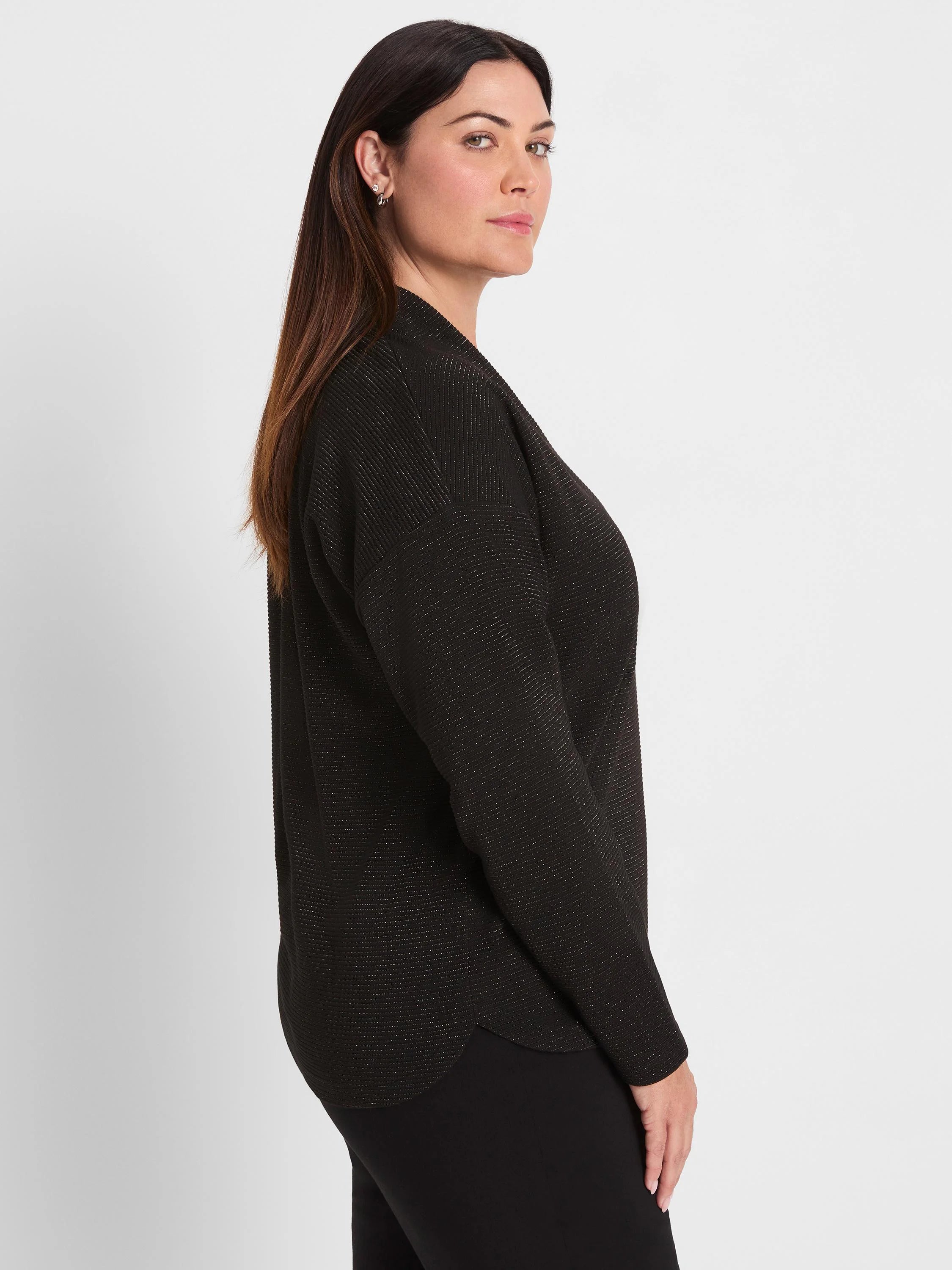Black long-sleeved top with fine horizontal sparkle stripes. Features a relaxed fit and a draped neckline.