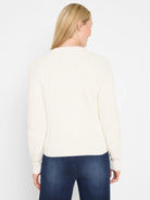 Off-white waffle knit cardigan with ribbed hem and cuffs, shown from the back on a model.