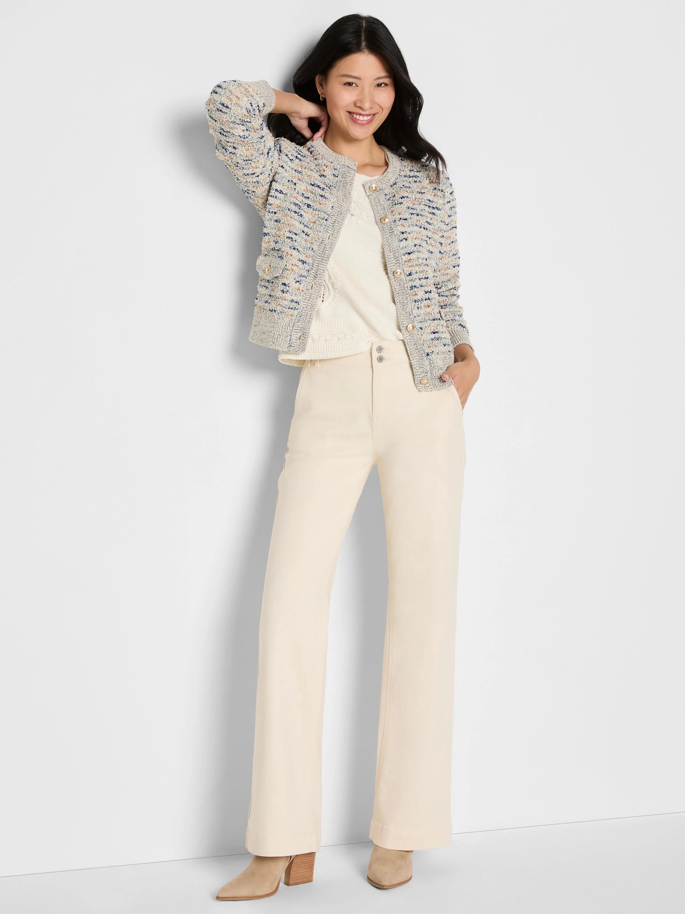 Cream knit jacket with blue & tan flecks, collarless, gold buttons & front patch pockets.