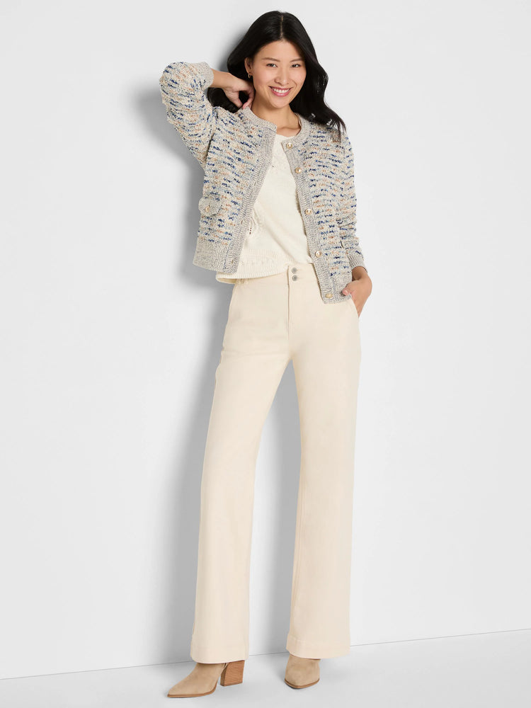 Cream knit jacket with blue & tan flecks, collarless, gold buttons & front patch pockets.