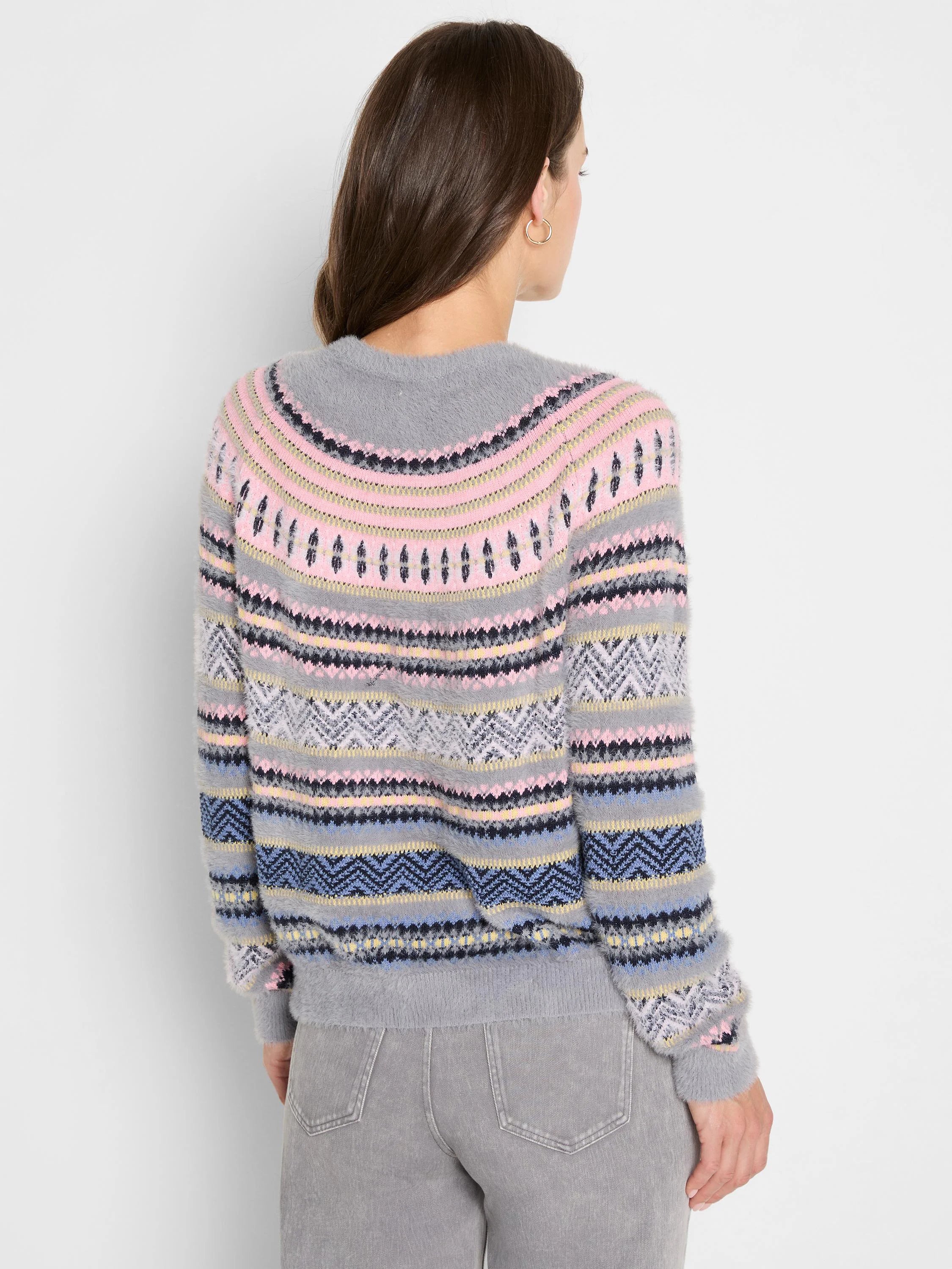 Fuzzy grey Fairisle sweater with pink, blue, yellow, and dark geometric patterns.