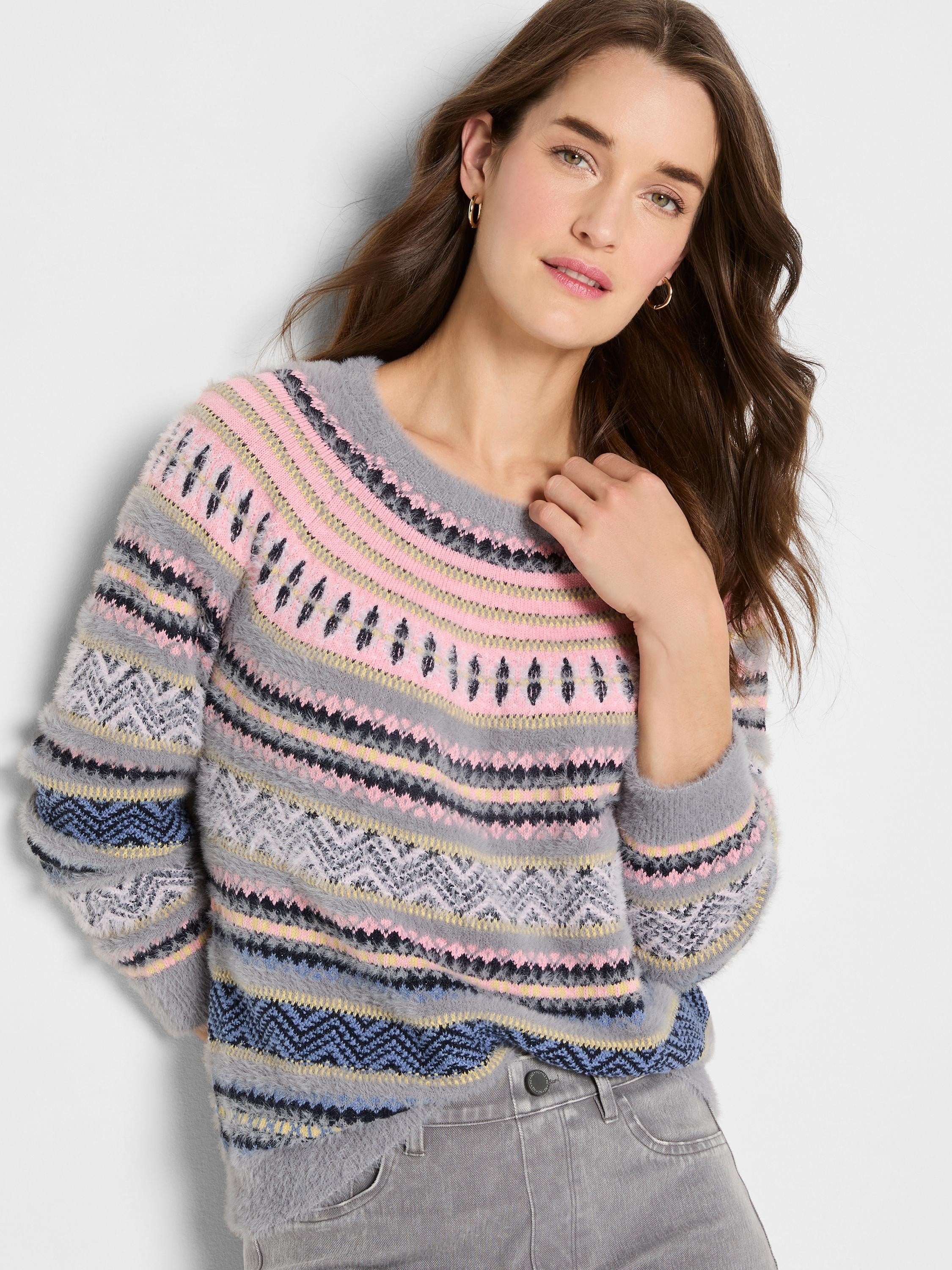 Fuzzy Fairisle sweater with grey, pink, black, yellow, and blue geometric patterns and horizontal stripes.
