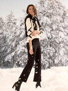 Cream sweater with black diagonal diamond pattern.