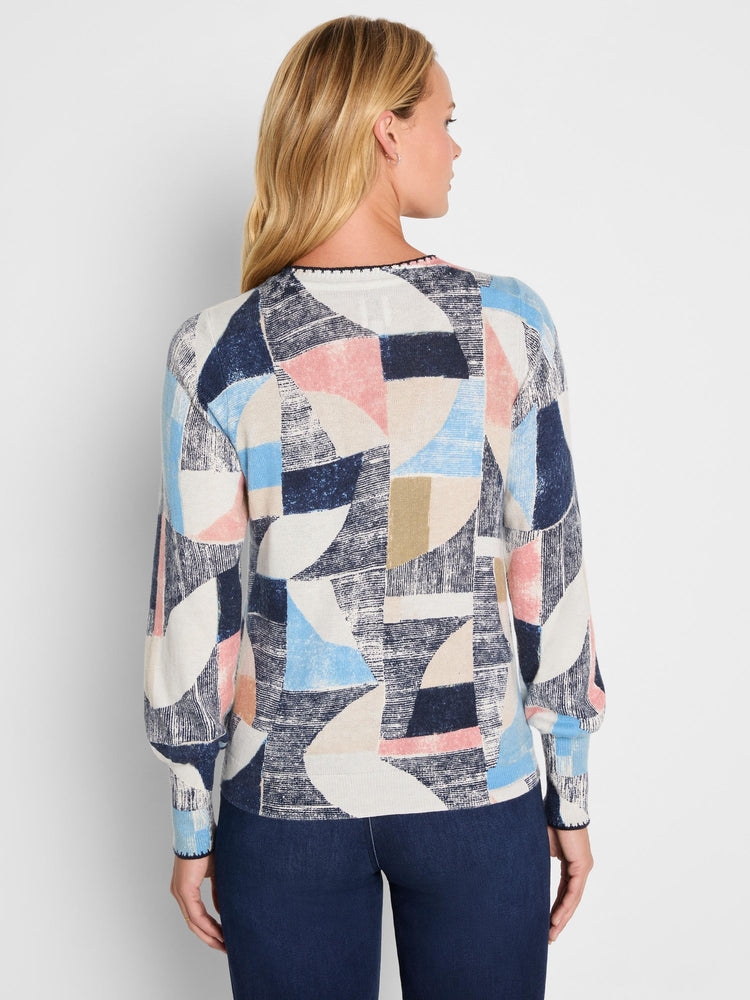Navy, light blue, blush pink, tan, & cream geometric pattern sweater. Crew neck, long sleeves, back view.