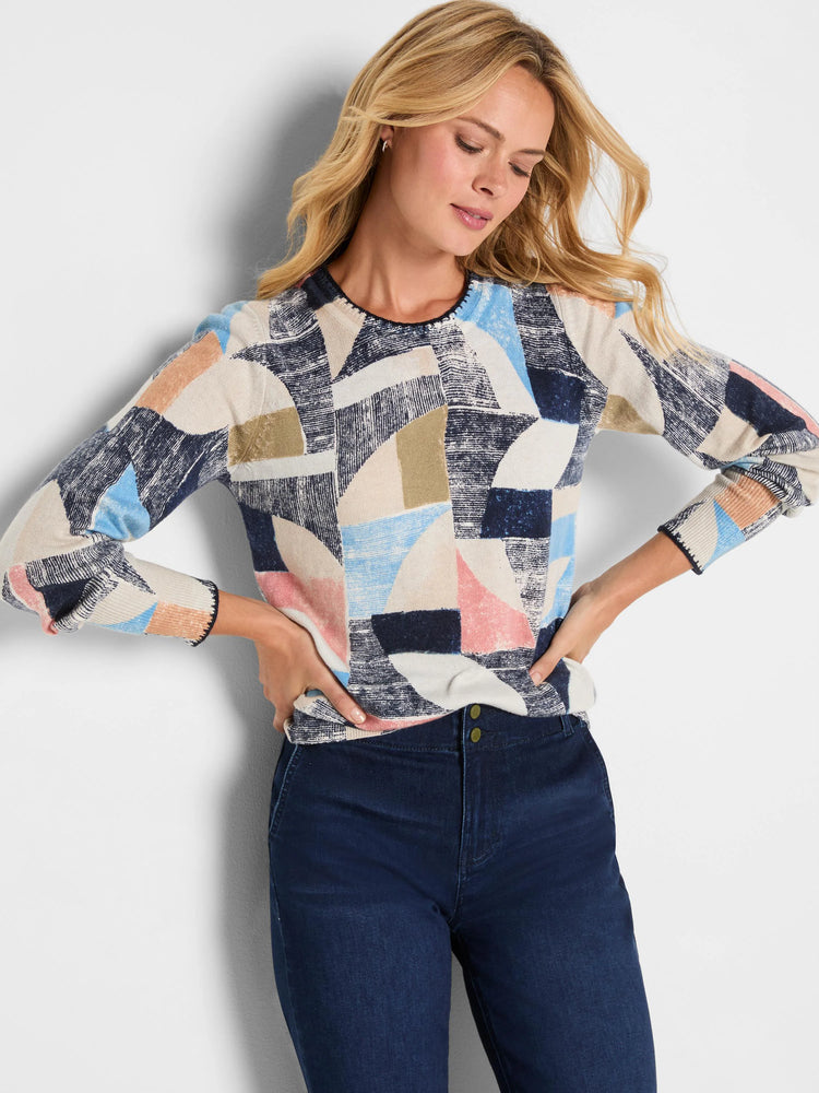 Sweater with abstract geometric pattern: navy, light blue, beige, peach, olive. Round neck, long sleeves.