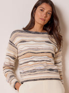 Cream, beige, brown, charcoal sweater with wavy stripes & varied textures, some areas fuzzy or frayed.