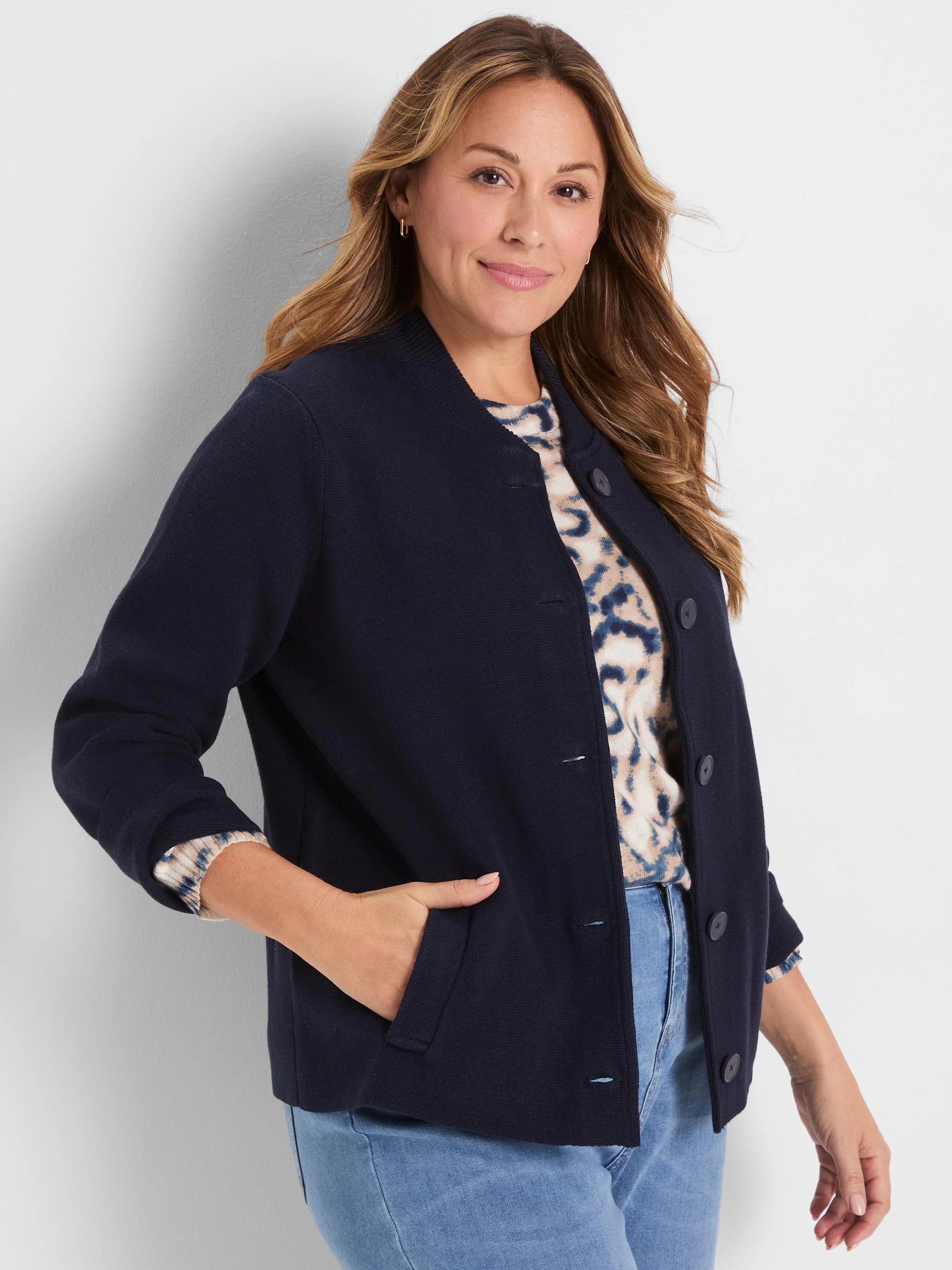 Dark blue knit bomber jacket with ribbed collar, button-front closure, and side pockets.