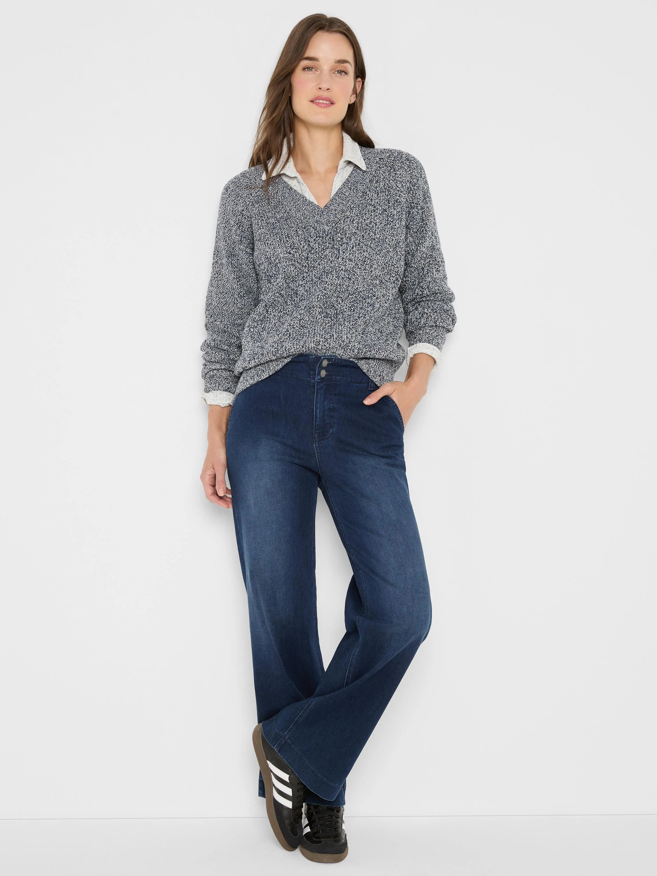 Model in marled navy & white V-neck shaker stitch sweater with relaxed fit.
