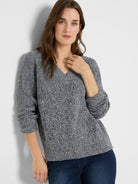 Marled indigo & white V-neck shaker knit sweater with a chunky texture and cuffed sleeves.