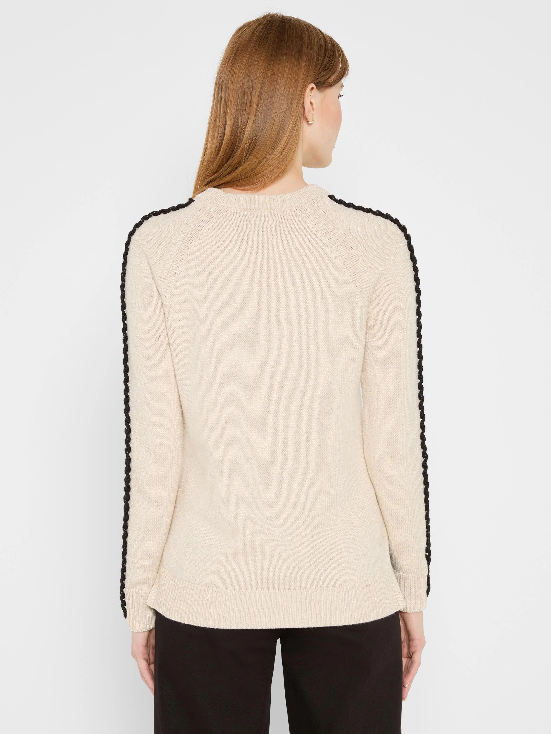 Metallic beige sweater with black braided stripes on raglan sleeves and shoulders. Crew neck, ribbed cuffs and hem.