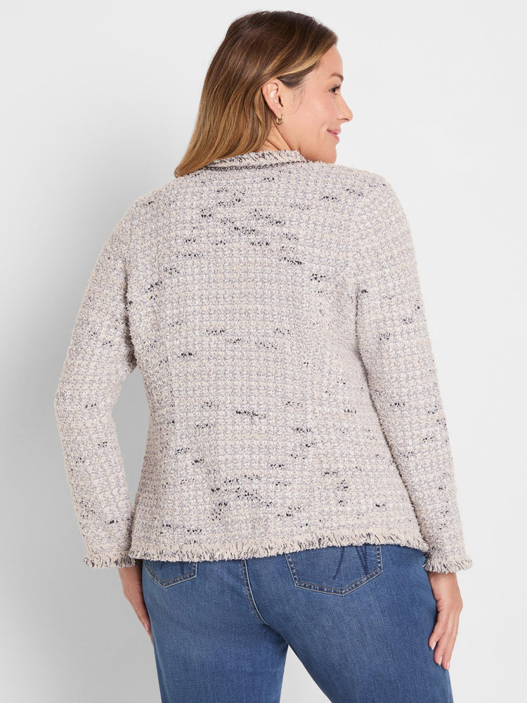 Multi-color mixed knit jacket: cream, light grey, black specks. Features dark chain trim at neckline & fringe hem/cuffs.