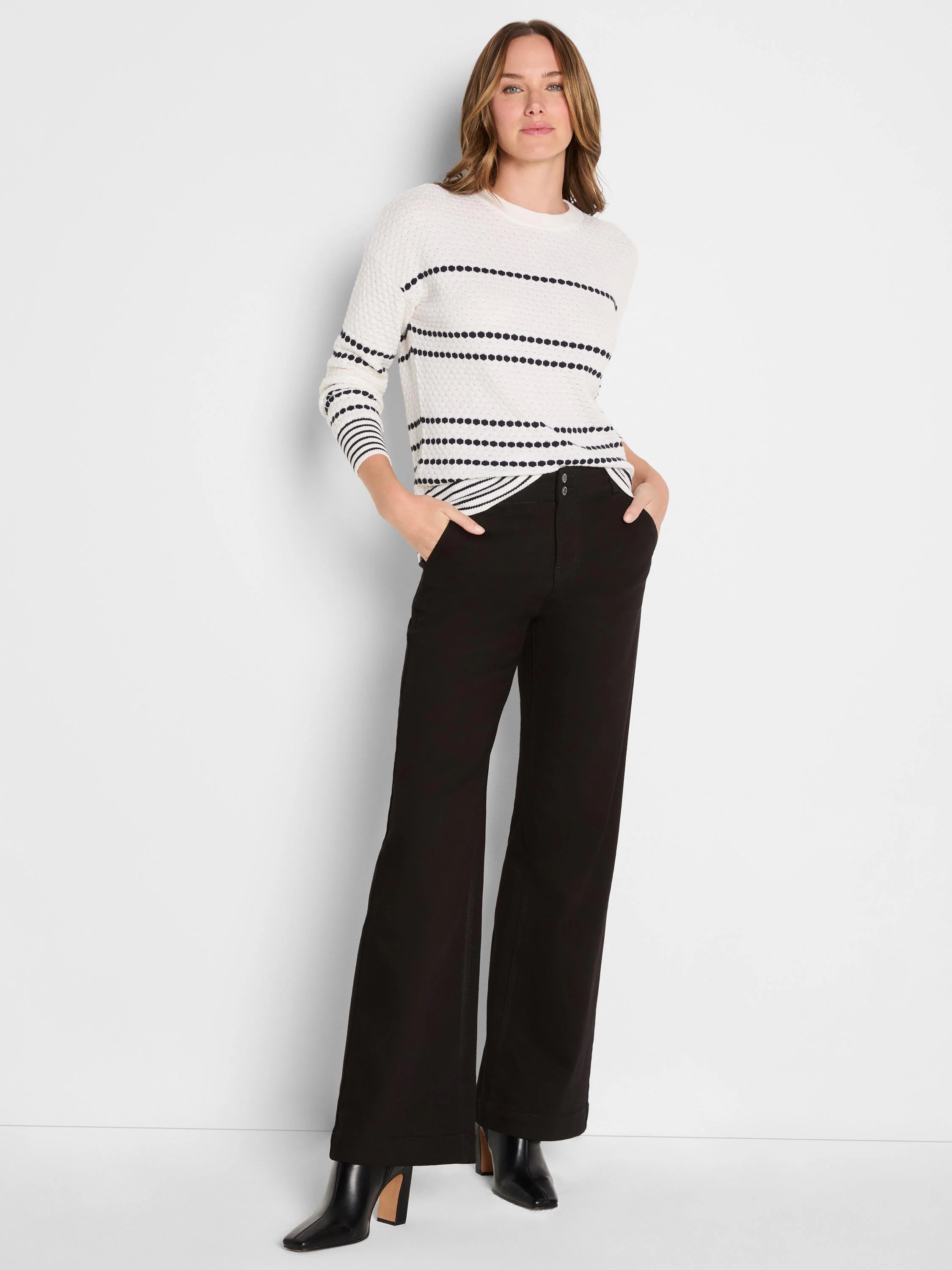 Off-white sweater with black dotted horizontal stripes.