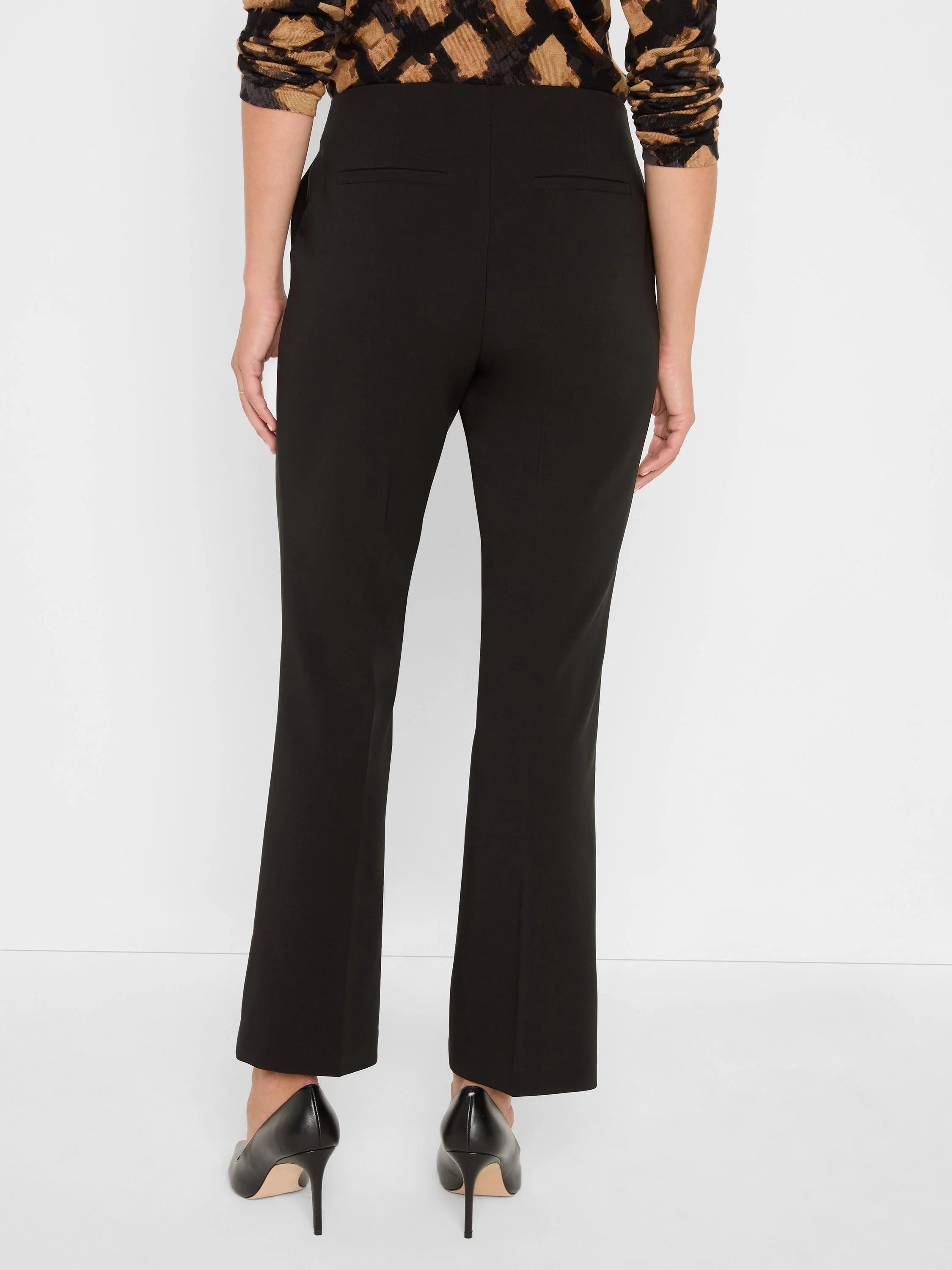Black demi boot pants, shown from behind. Features back welt pockets and subtle vertical seams.